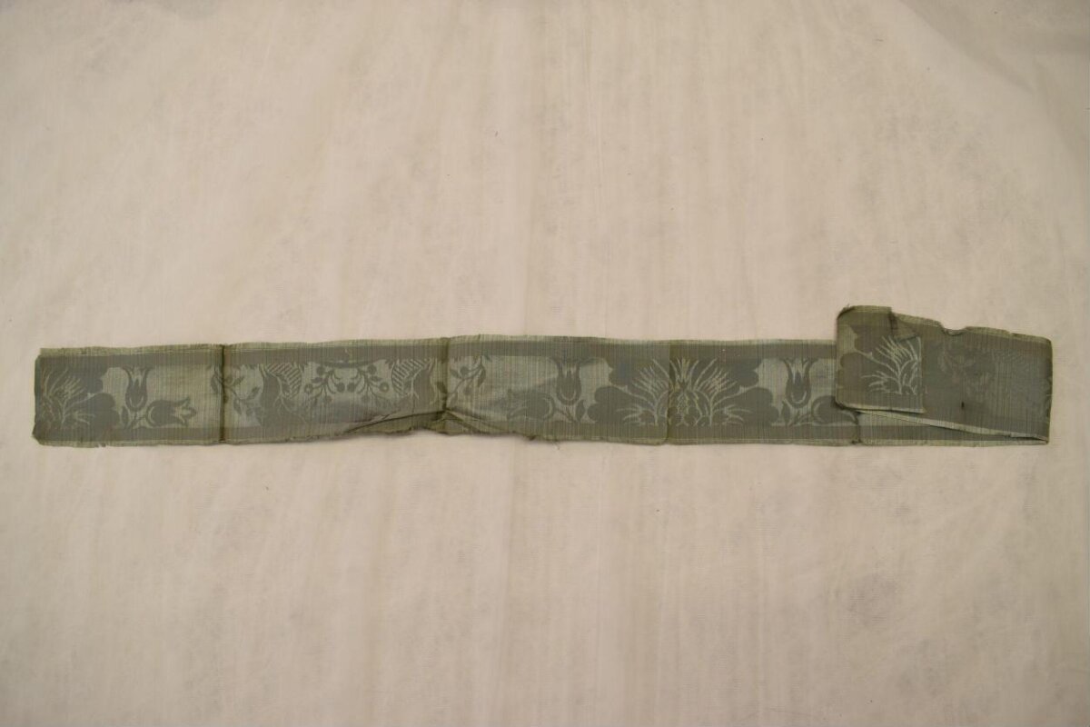 Folded Green Patterned Textile Strip