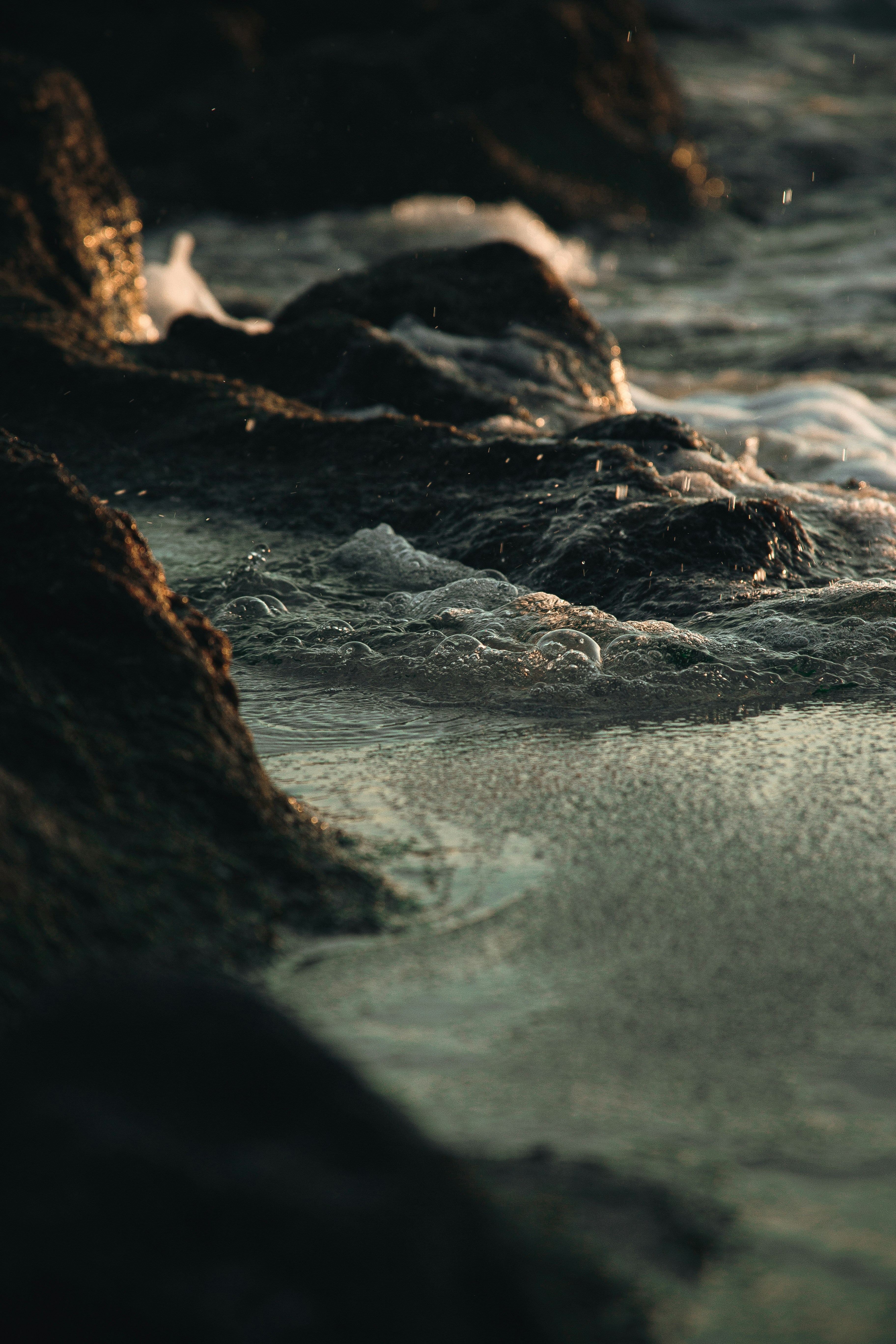 Waves Lap at Coastal Rocks
