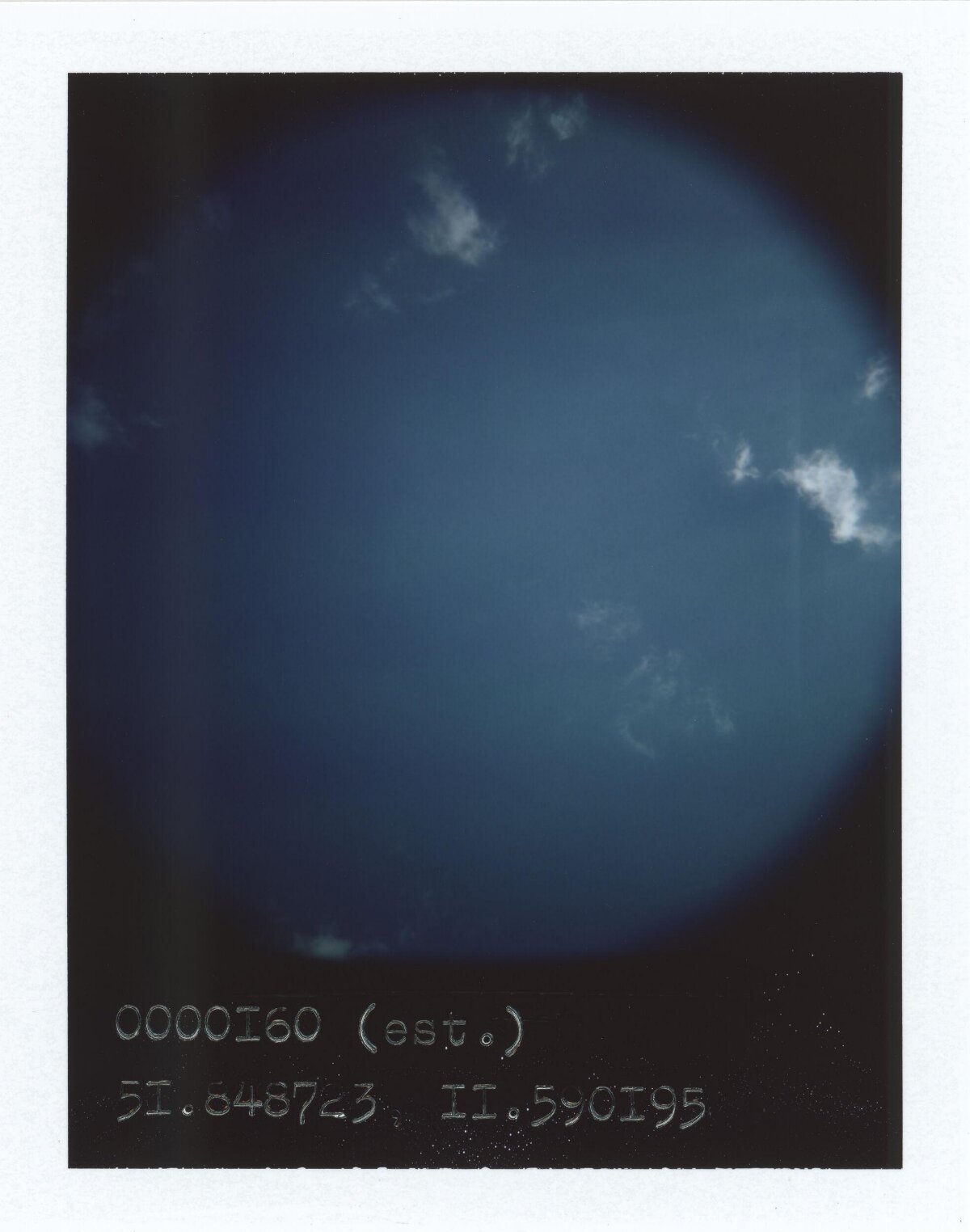 Deep Blue Sky With Scattered Clouds