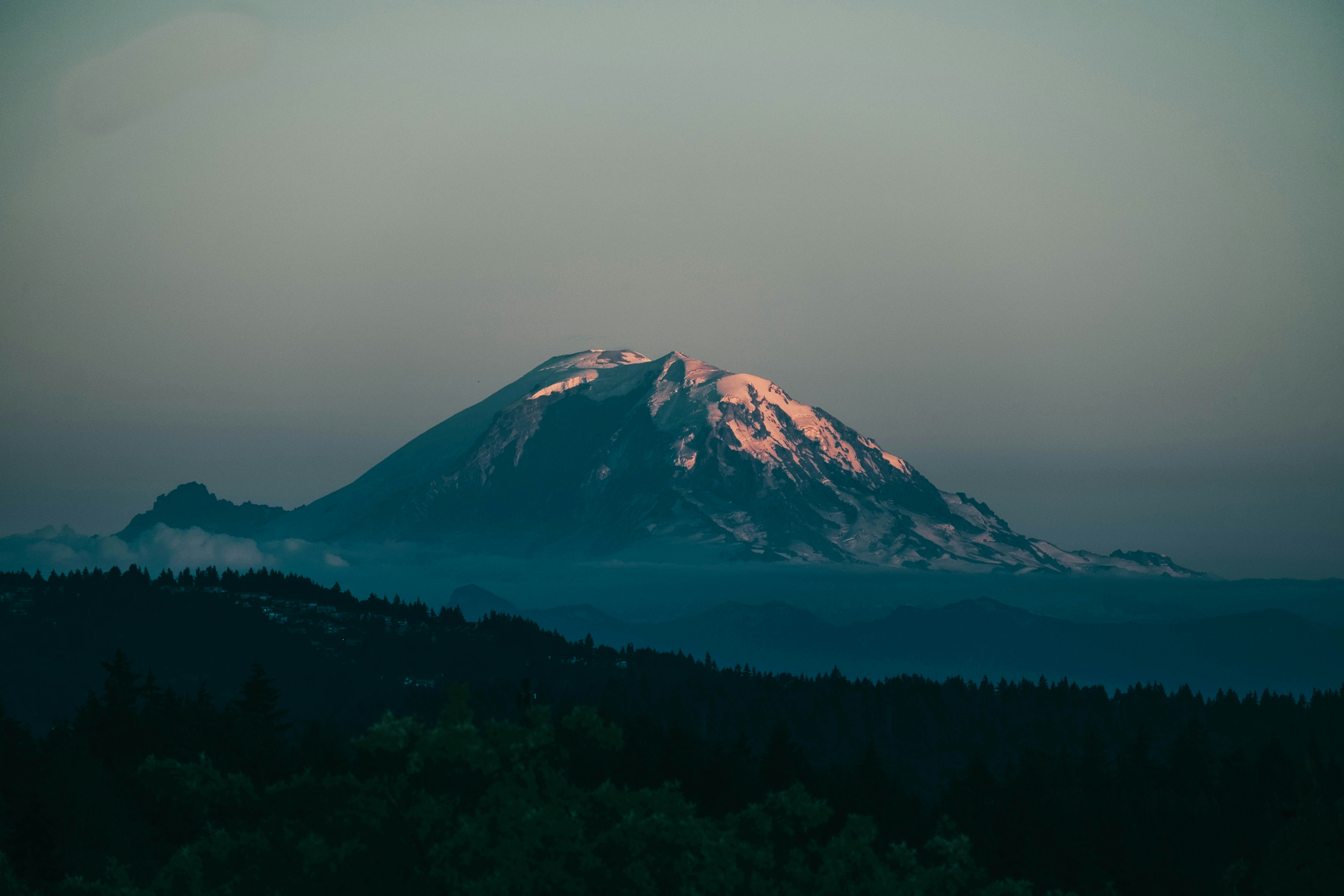 Sunlit Snow-capped Mountain at Dusk