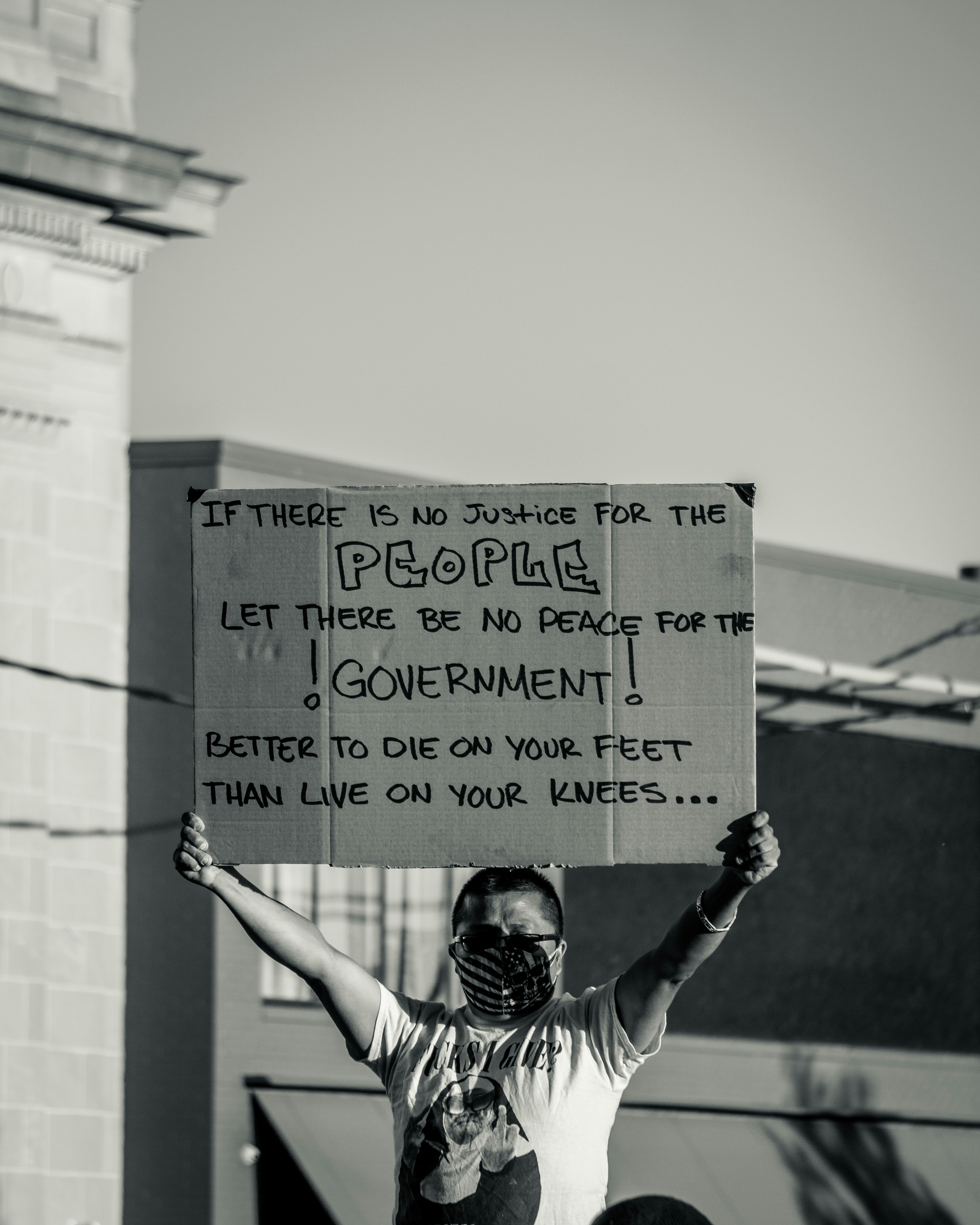 Protester Holding Protest Sign