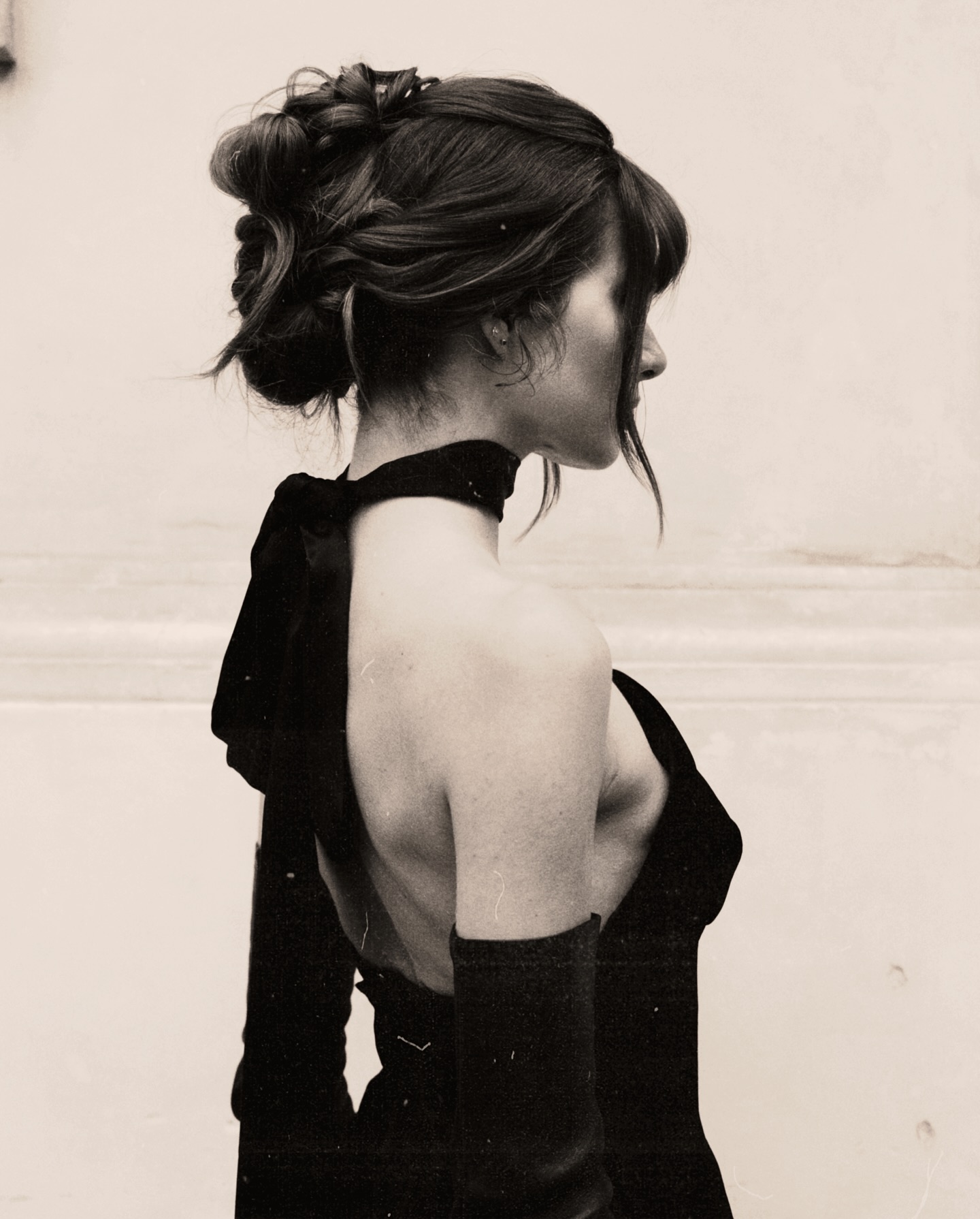 Profile of Woman in Black Evening Dress