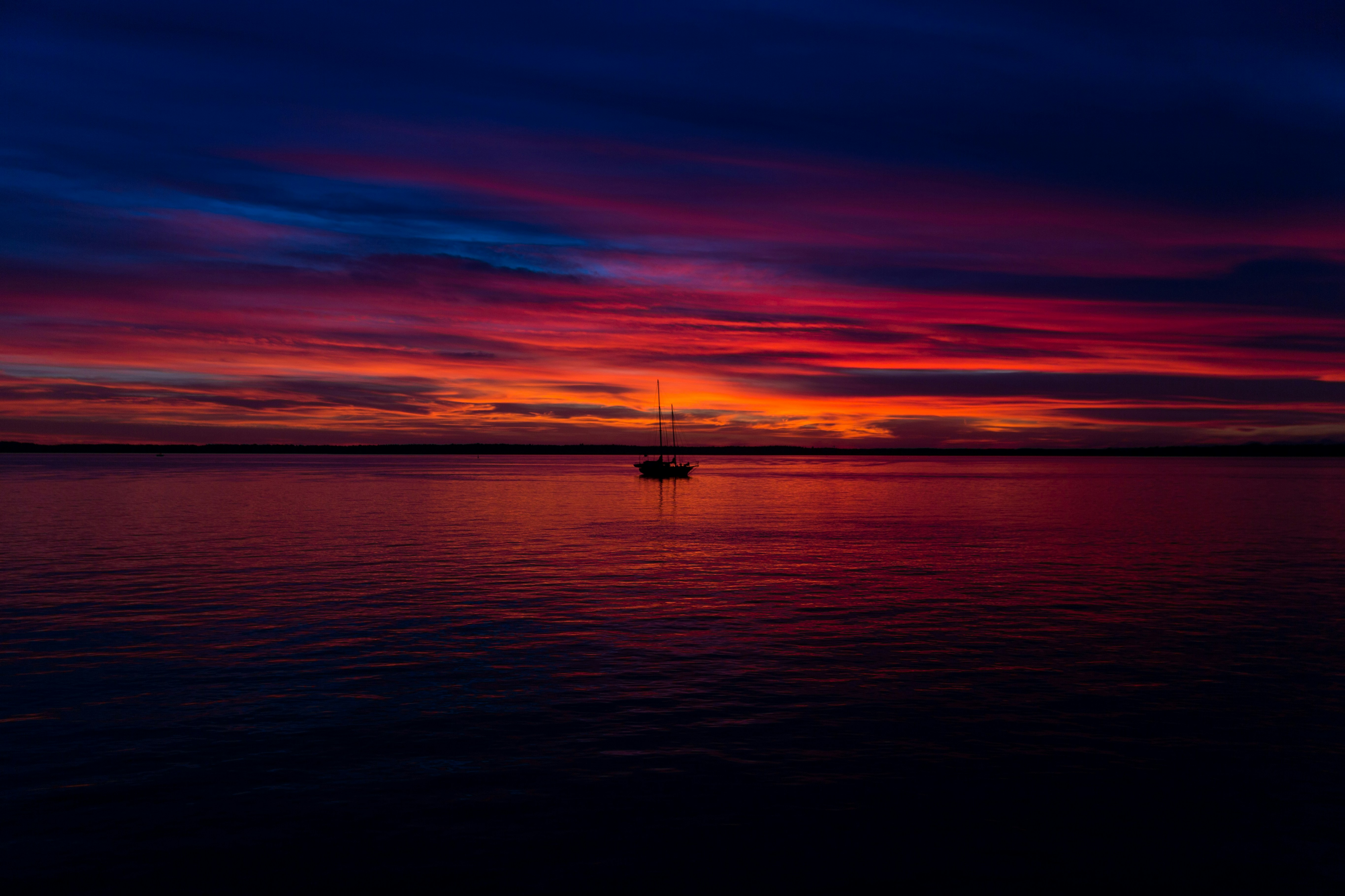 Sailboat on Sea at Sunset