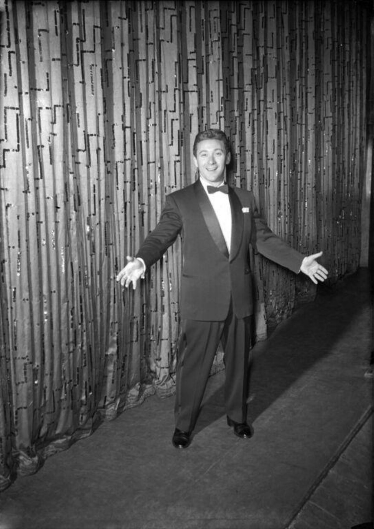 Smiling Male Performer in Tuxedo