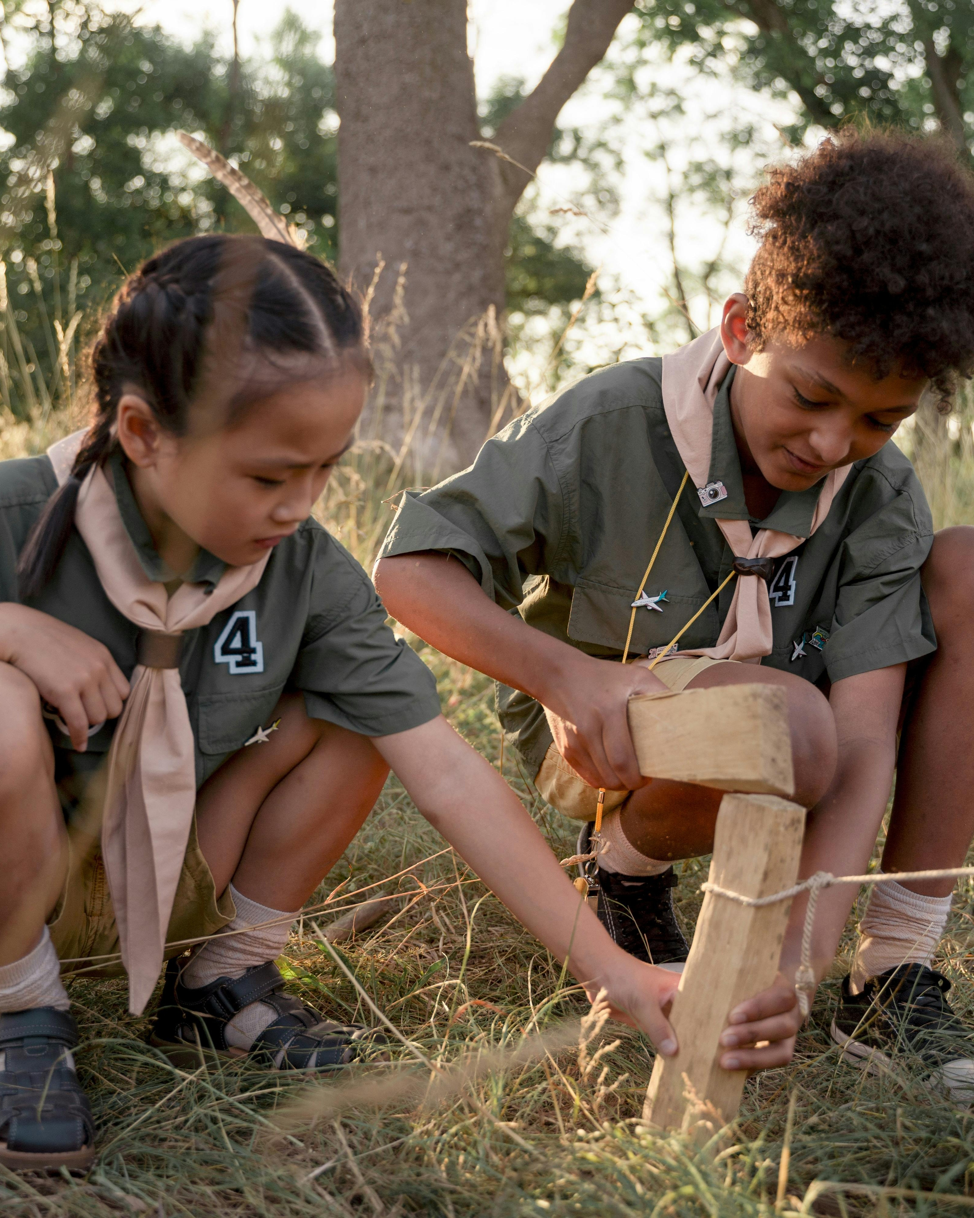 Two Scouts Working on Outdoor Project
