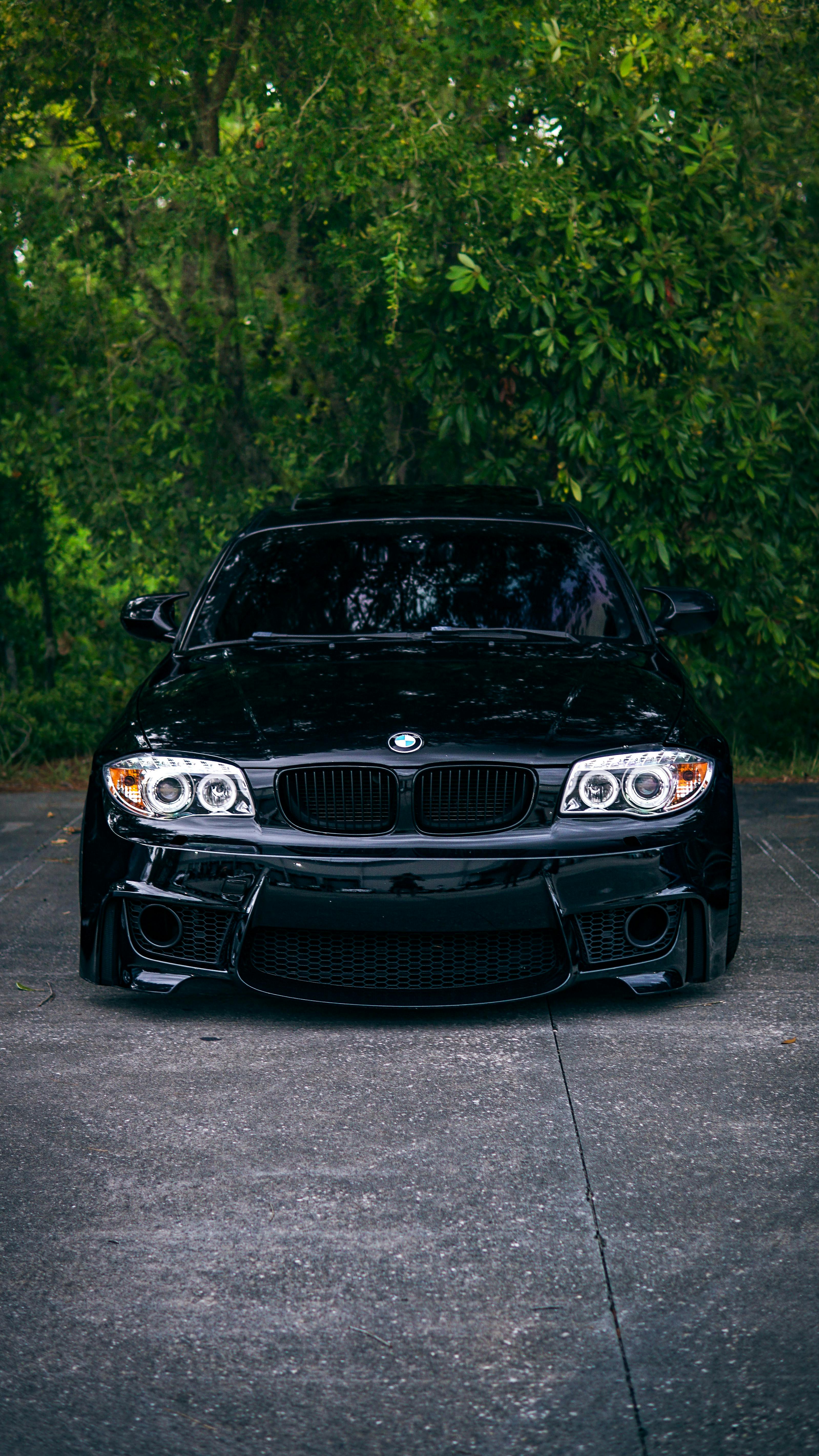 Glossy Black BMW Parked Outdoors