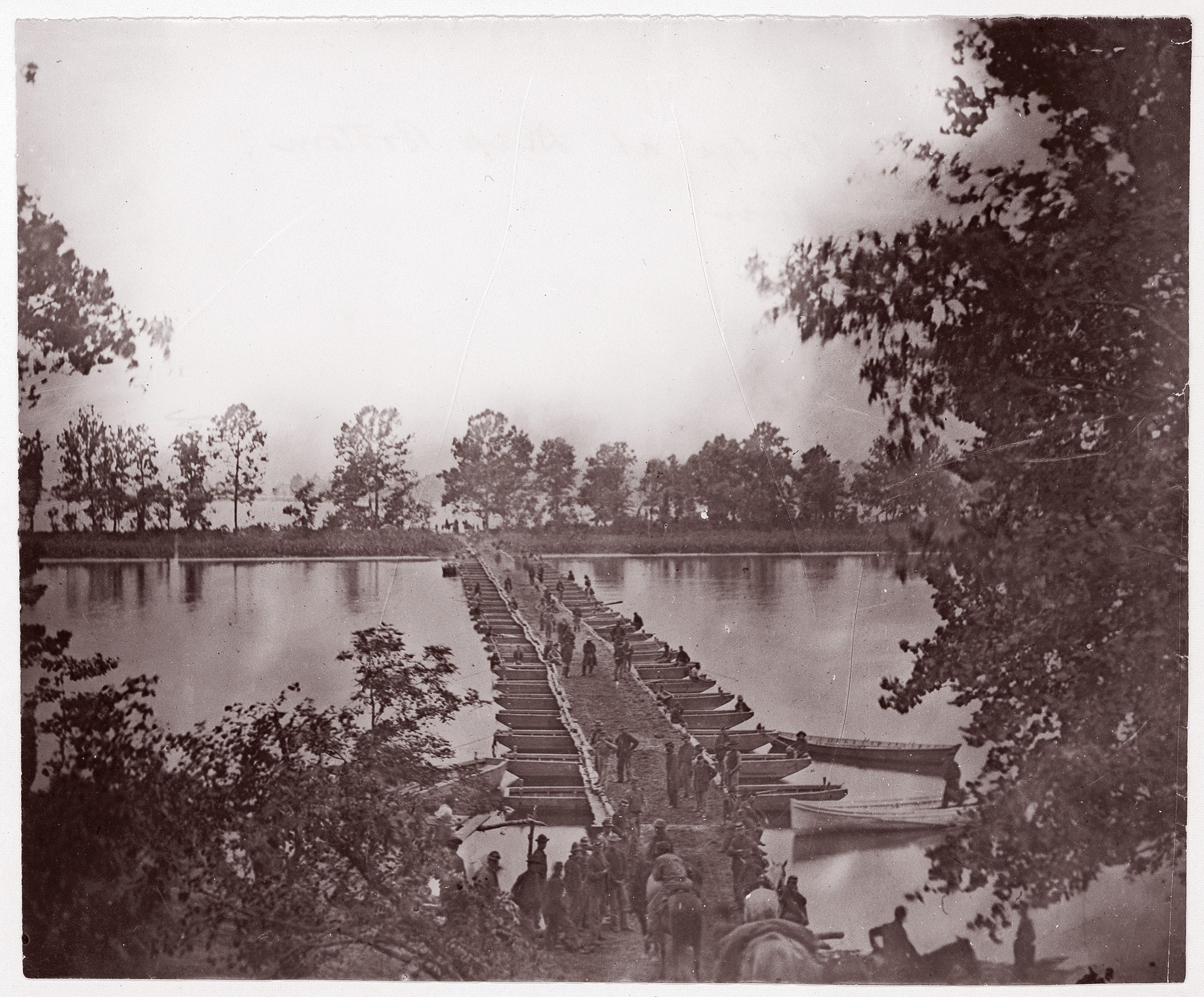 Soldiers Crossing Pontoon Bridge Over River