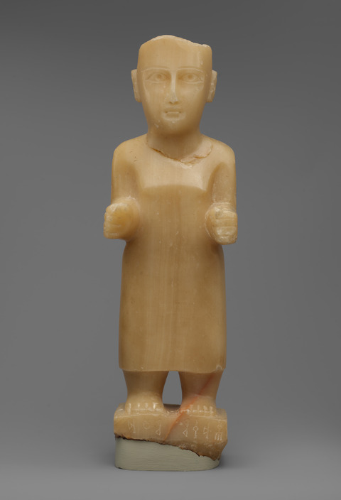 Ancient standing male stone statue