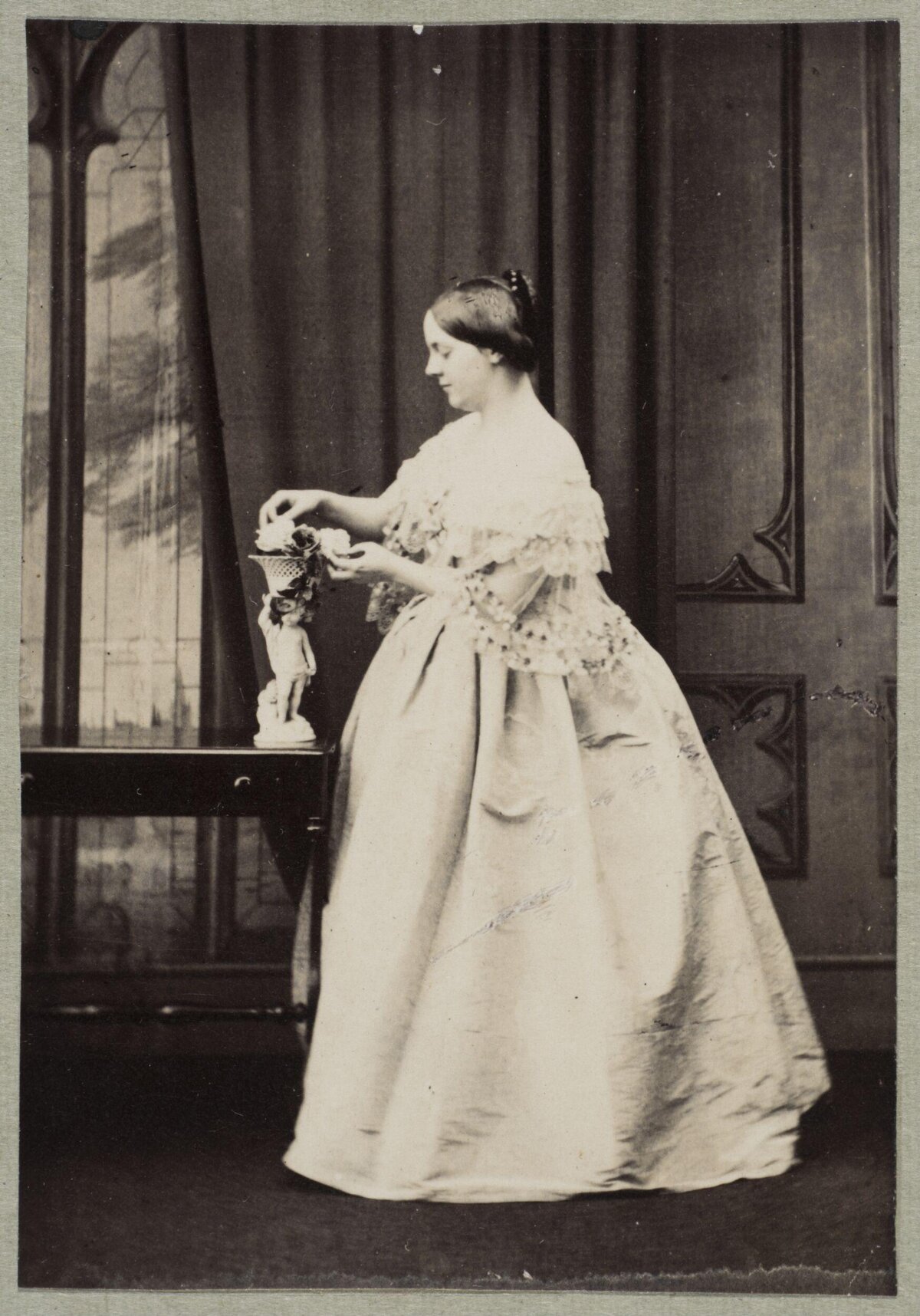 Vintage Portrait of Woman Arranging Flowers