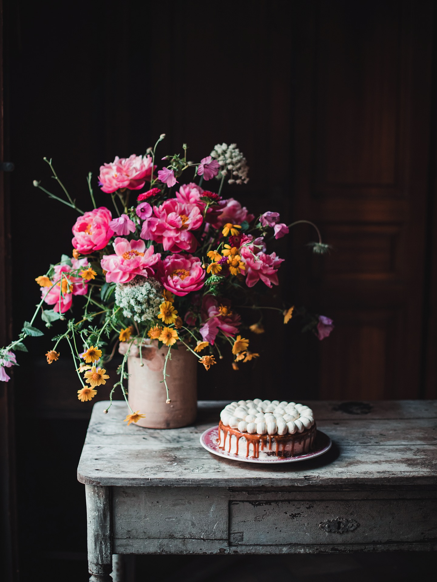 Flower Bouquet and Cake on Rustic Table