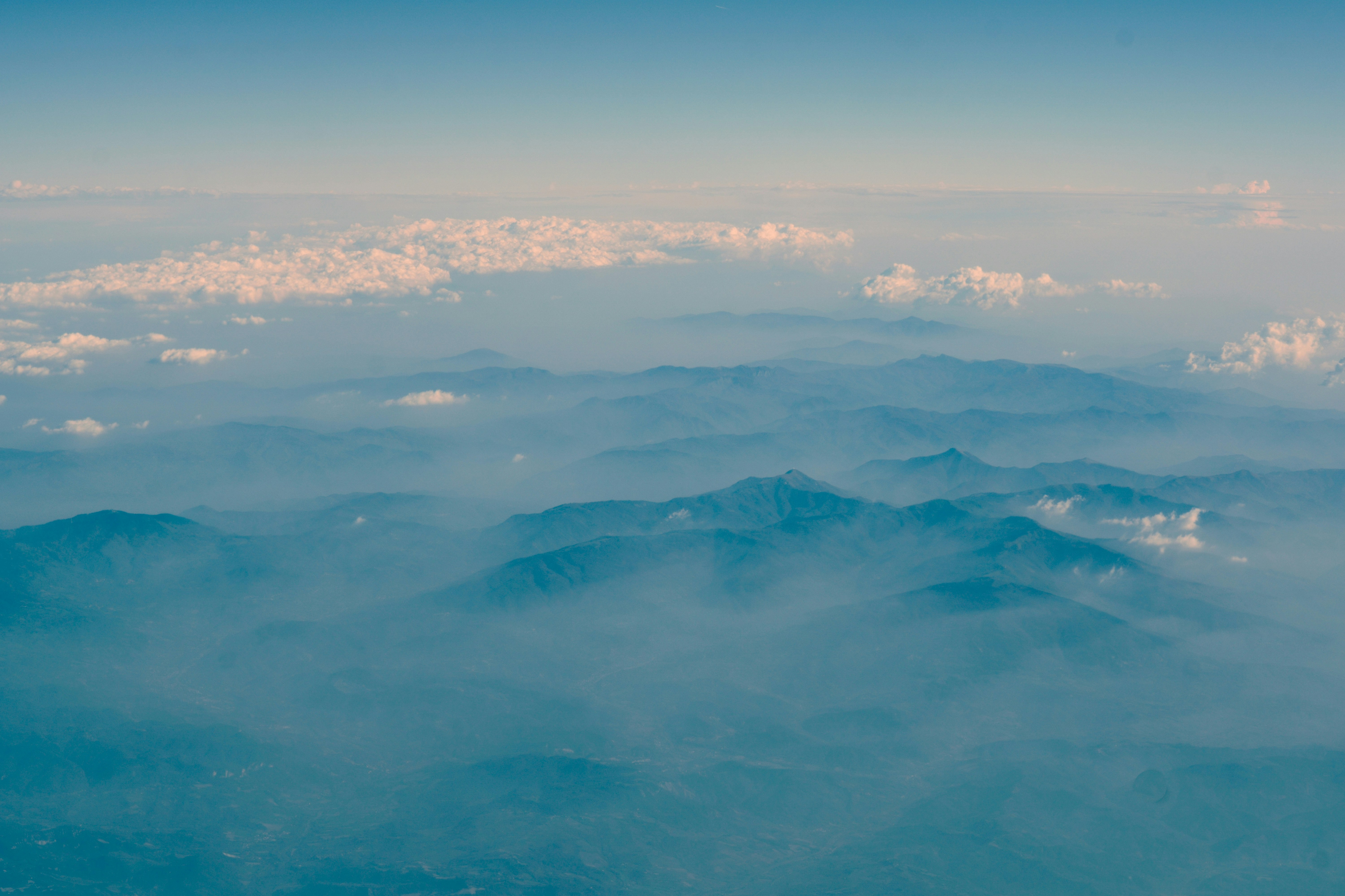 Aerial View of Layered Misty Mountains