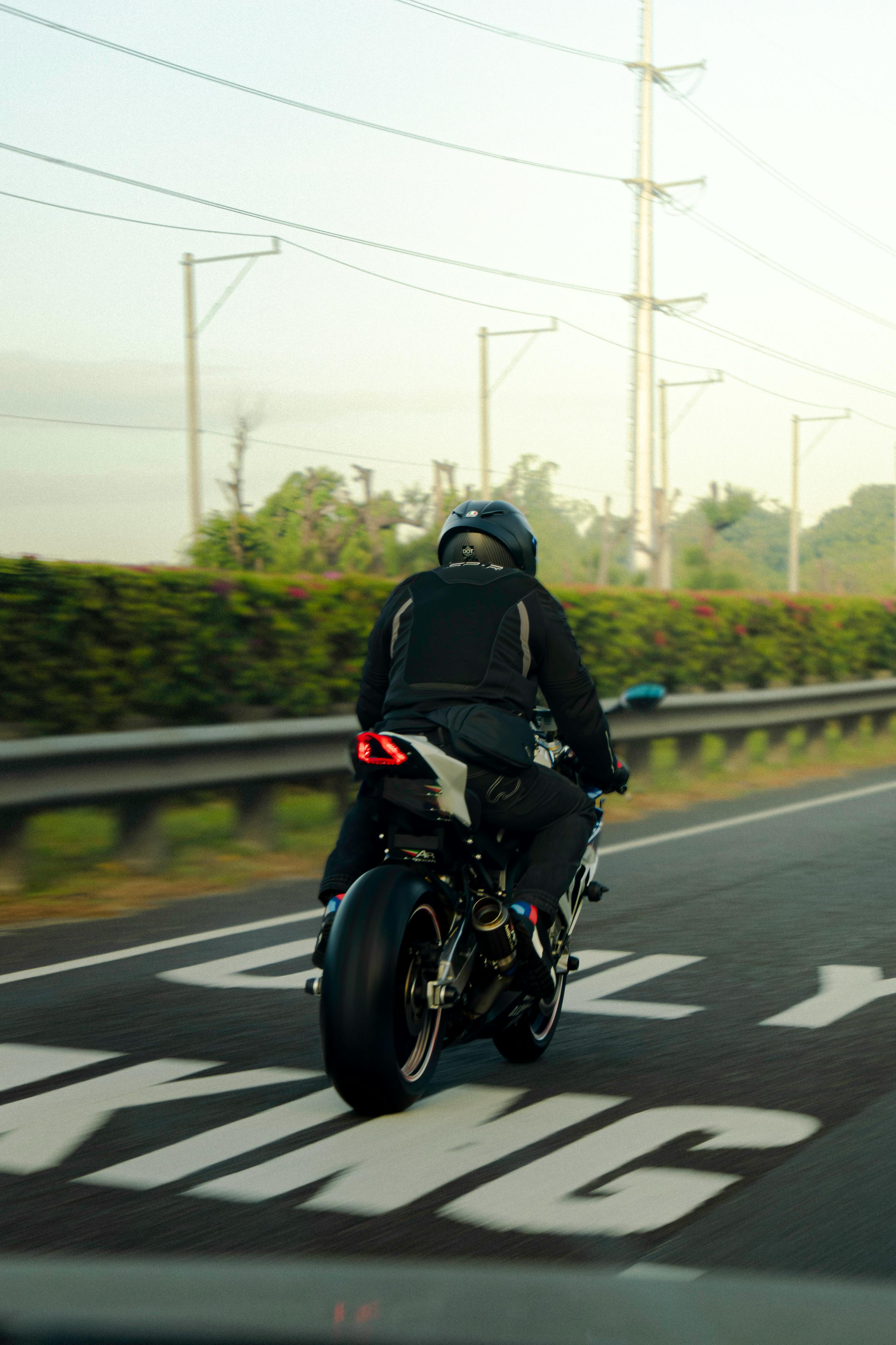 Motorcyclist Riding On Highway