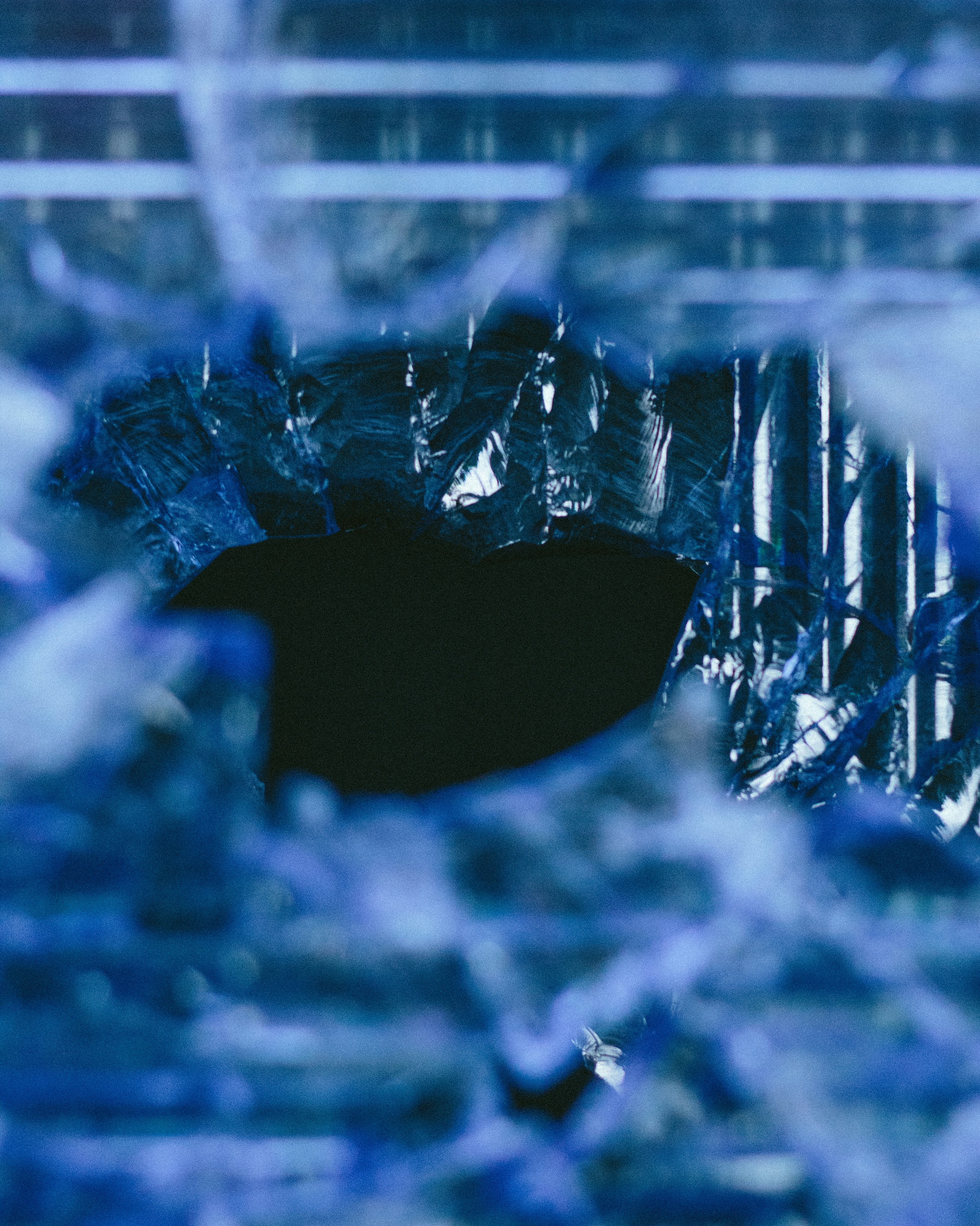 Hole in Frozen Blue Ice — Abstract Backgrounds