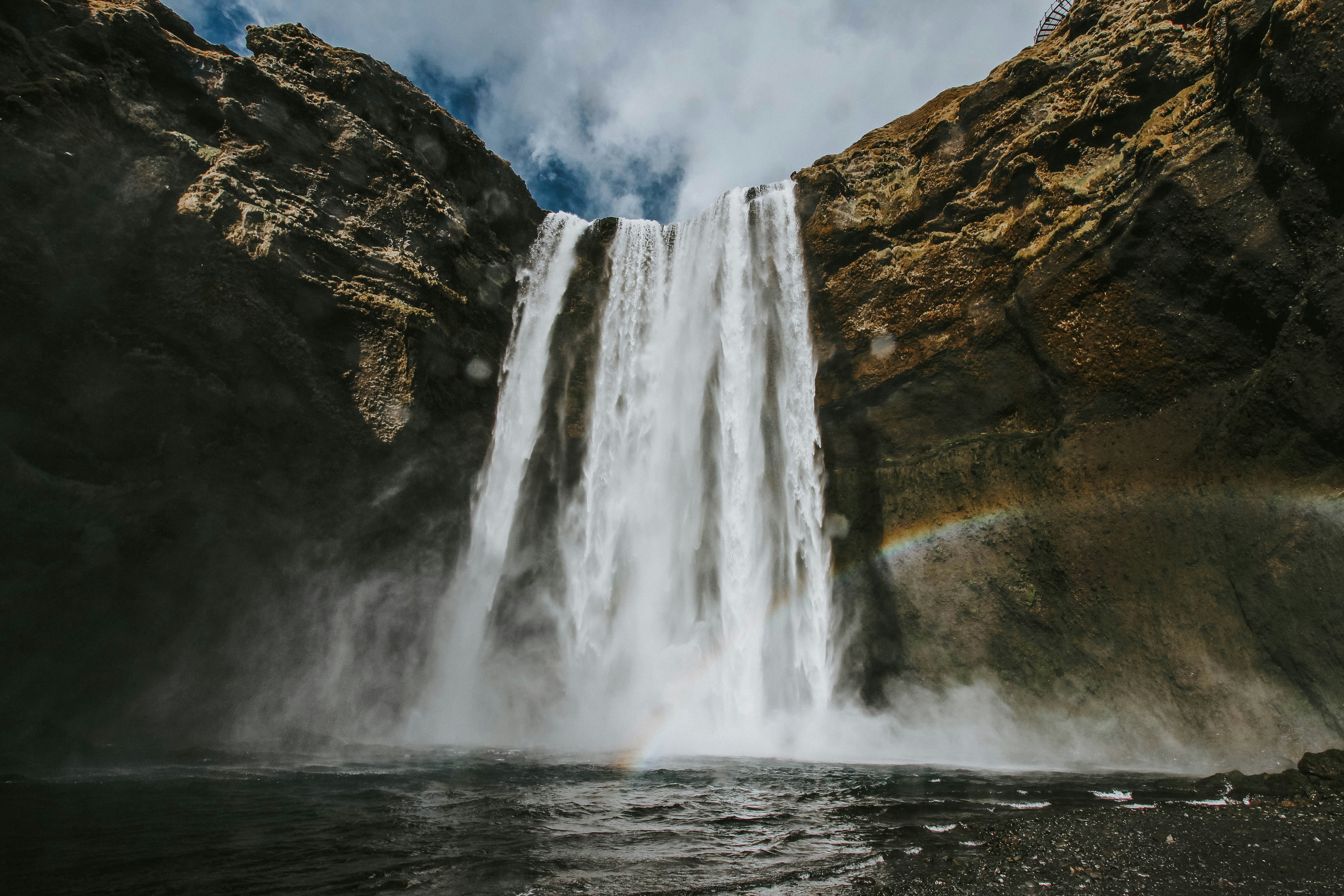 Waterfall Between Rocky Cliffs