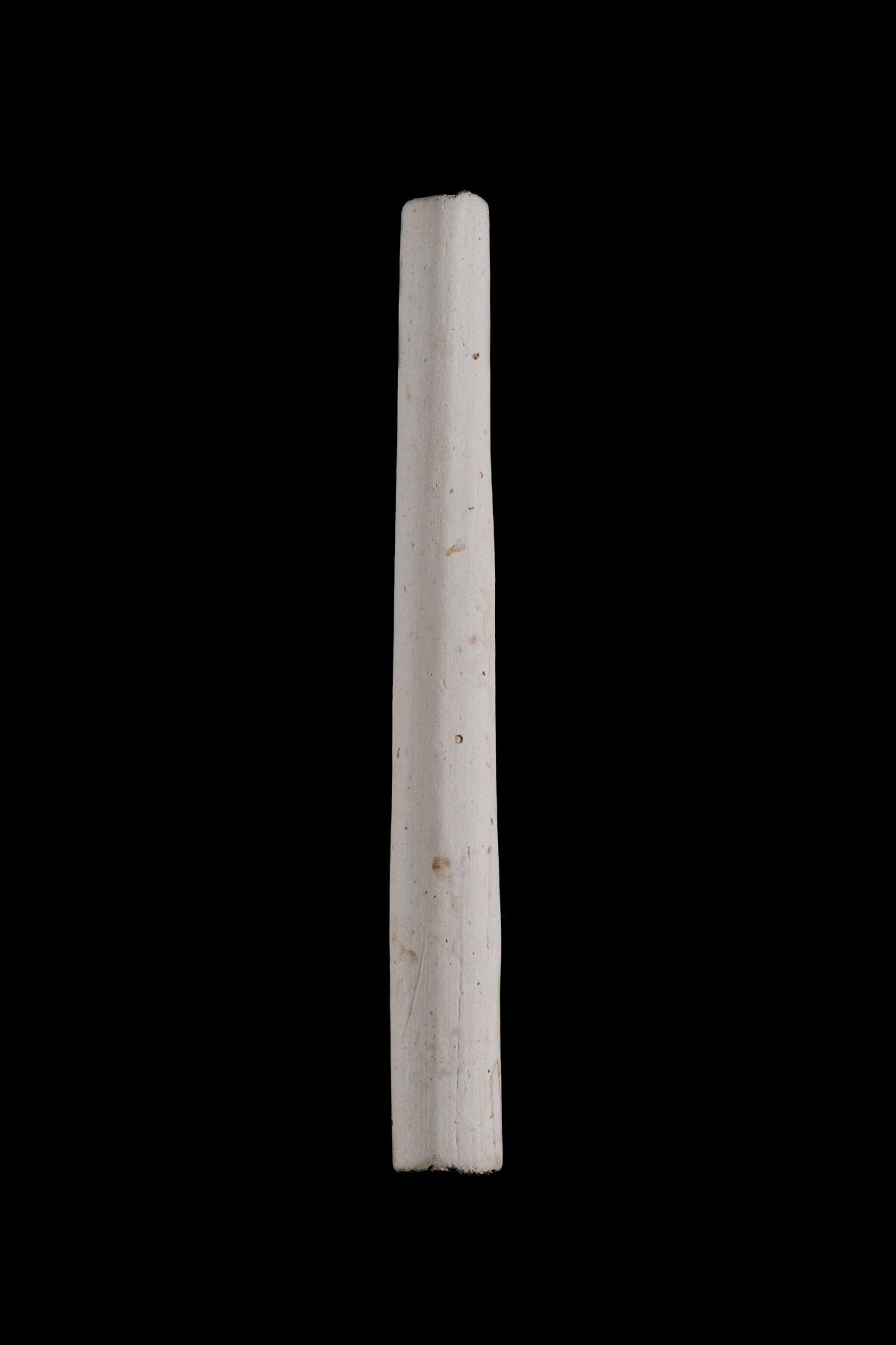 White Cylindrical Object on Black Background