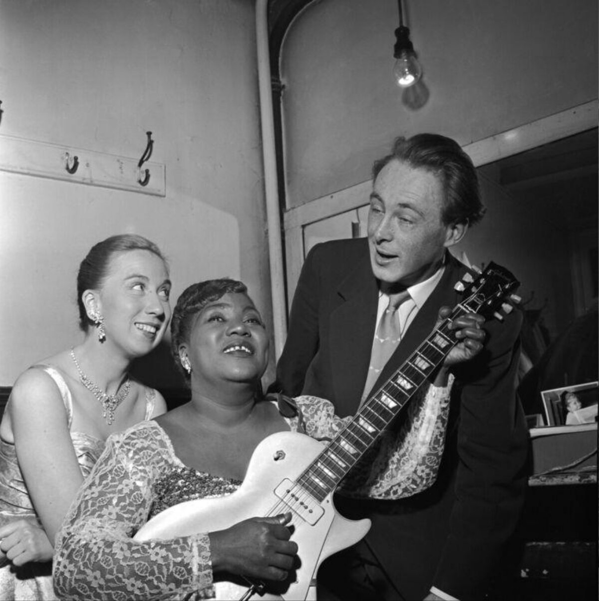 Three People Backstage With Electric Guitar