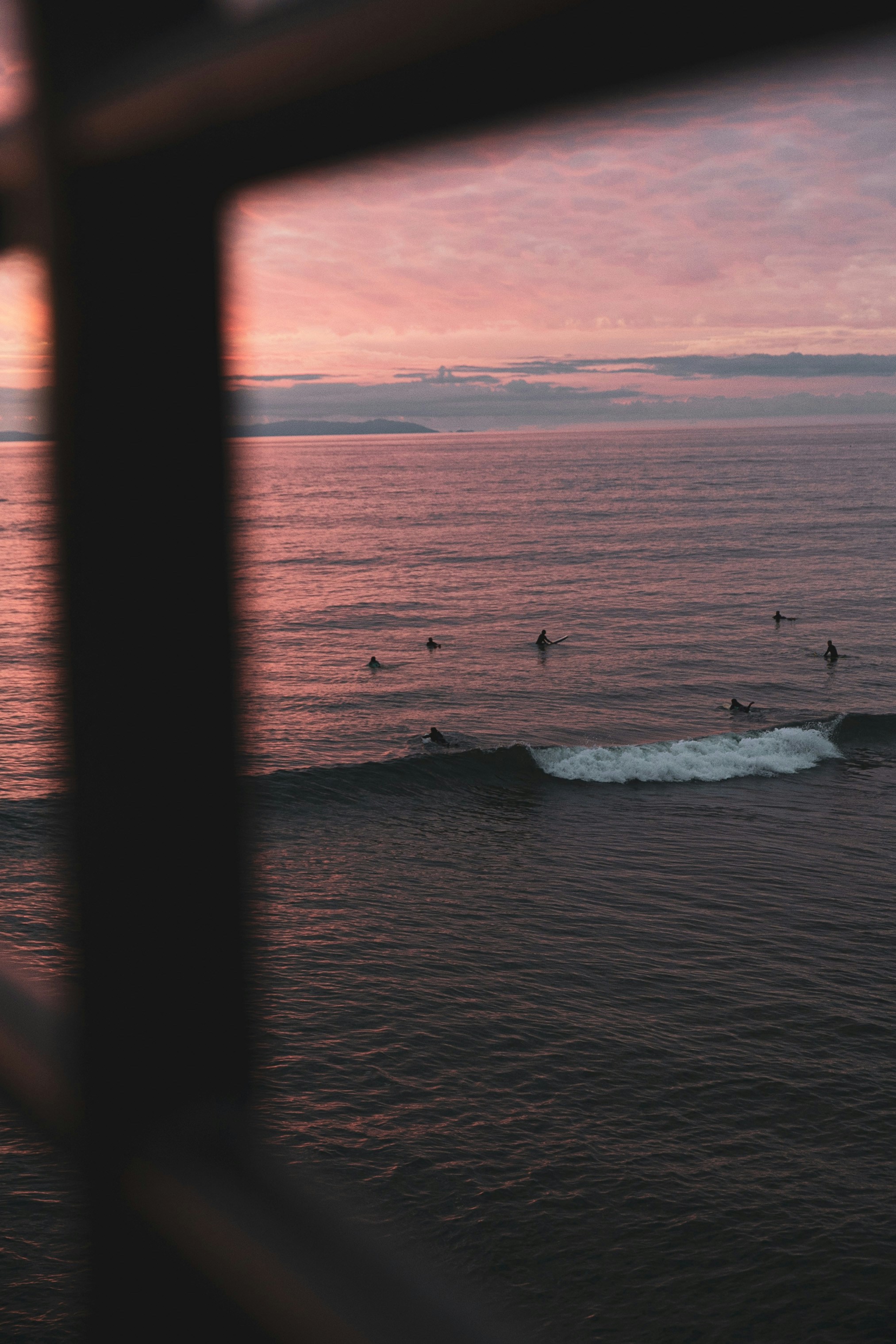 Surfers Waiting for Waves at Sunset