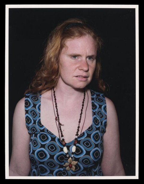 Studio Portrait of Red-haired Woman