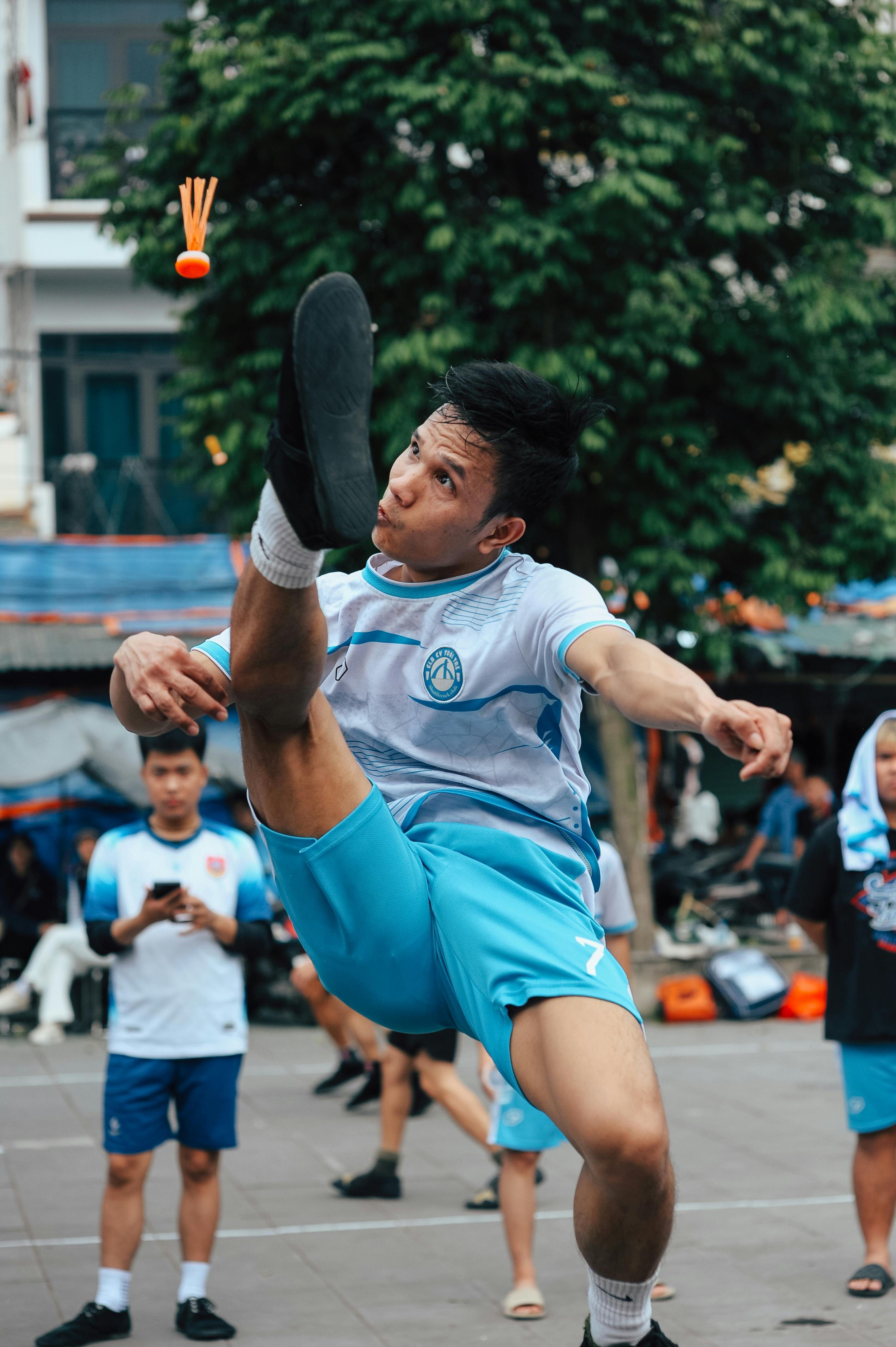 Man Playing Sepak Takraw Outdoors
