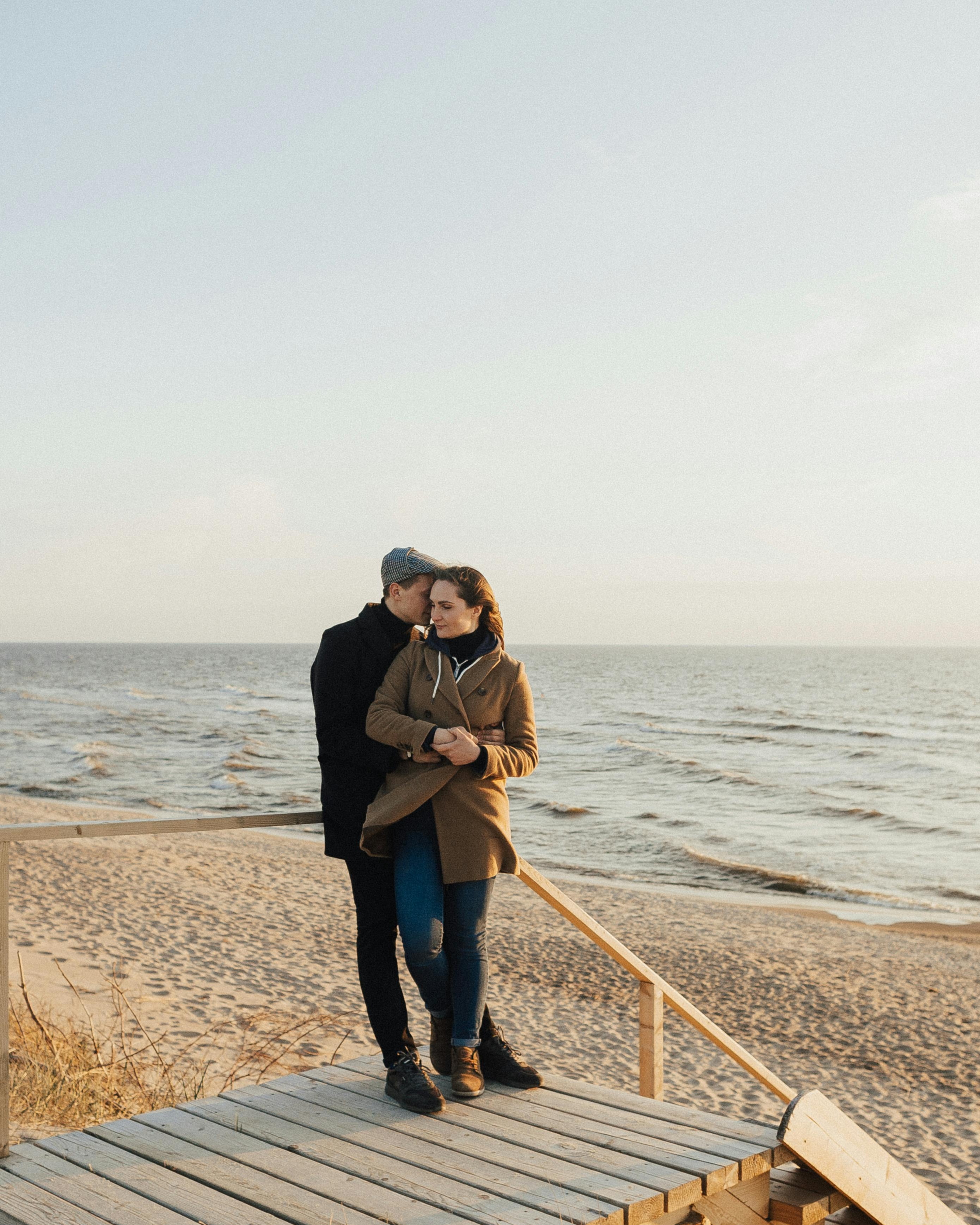Couple Embracing On Seaside Beach
