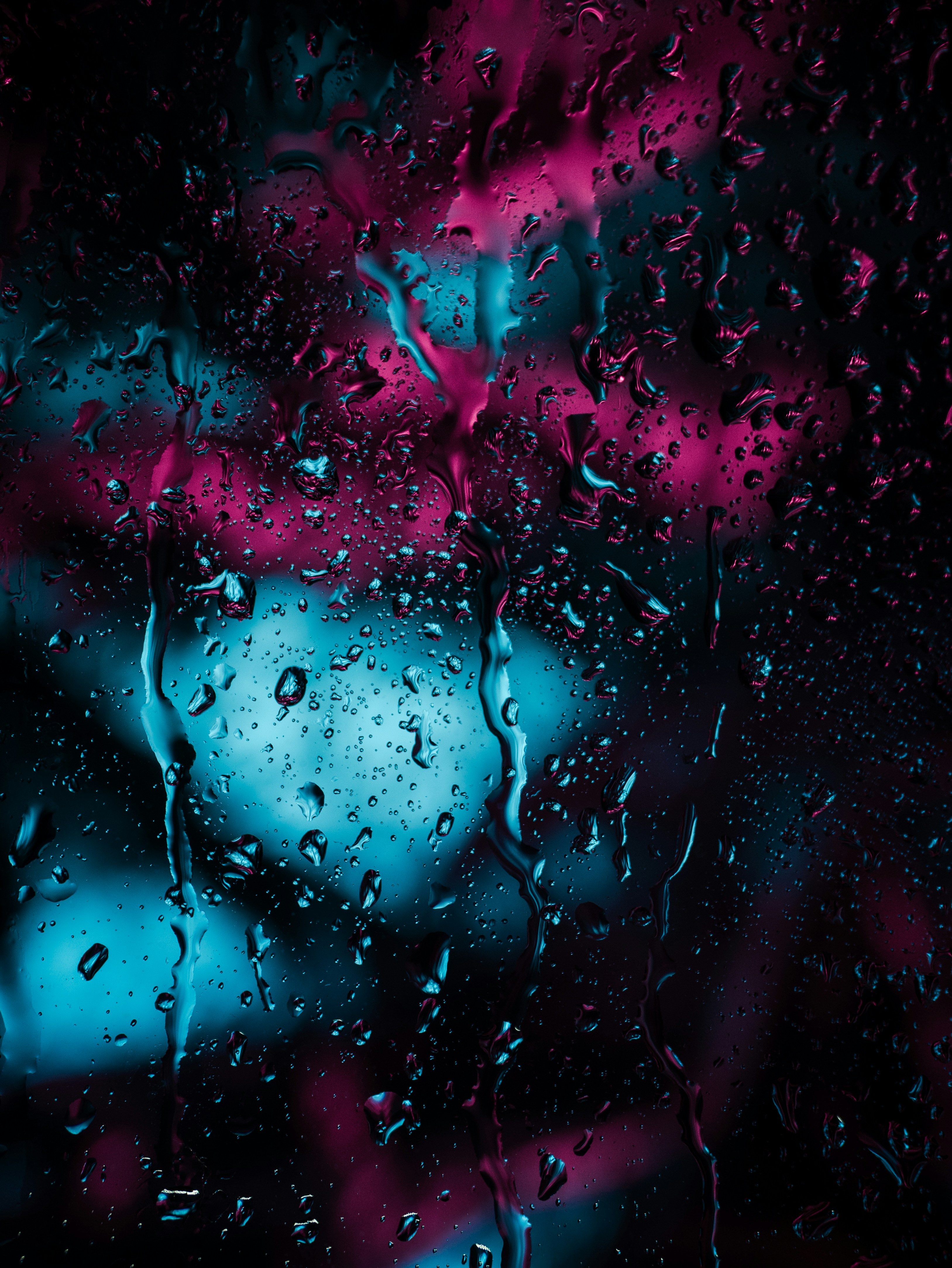 Raindrops on Glass with Neon Light