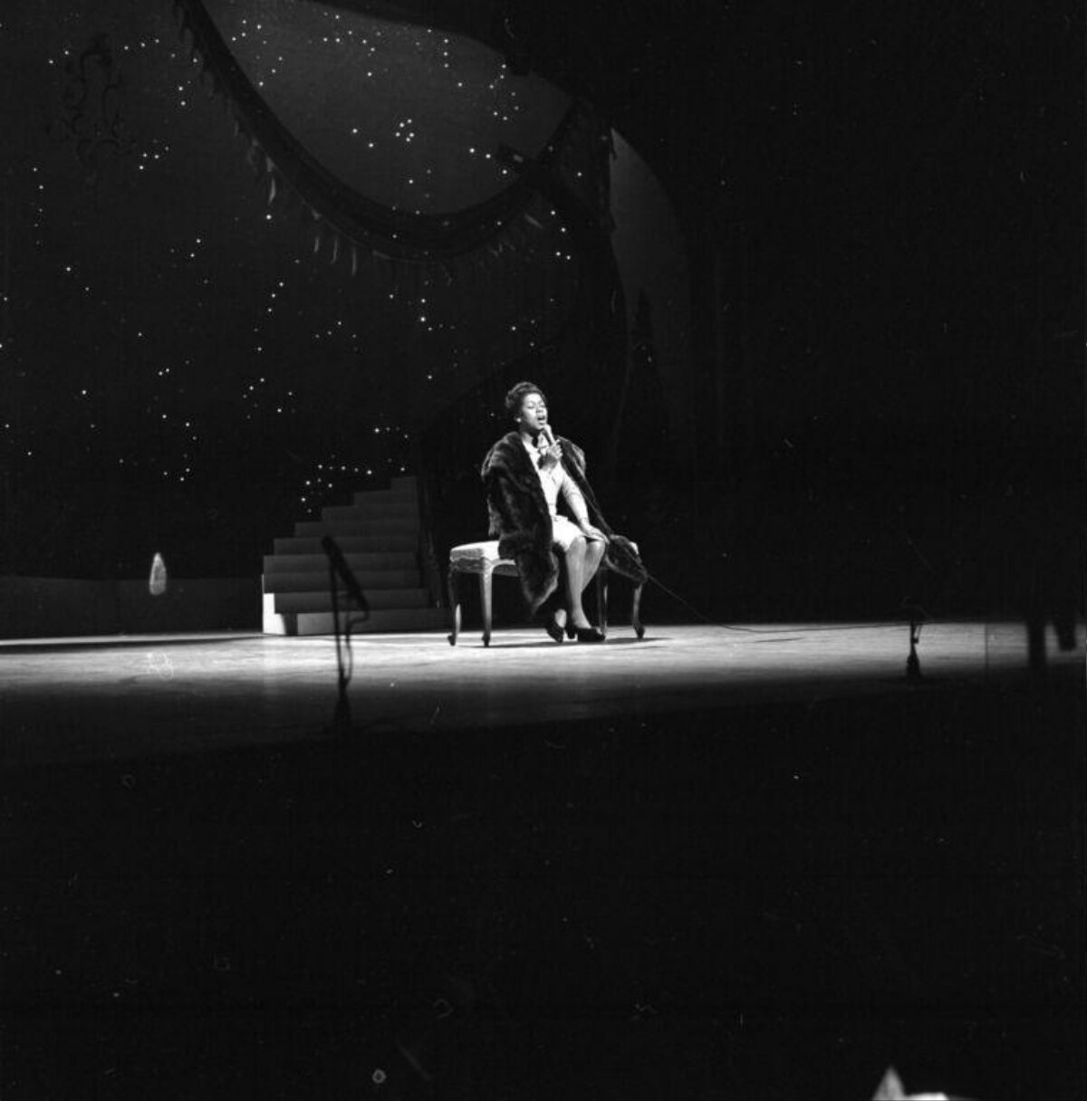 Female Singer Performing on Stage