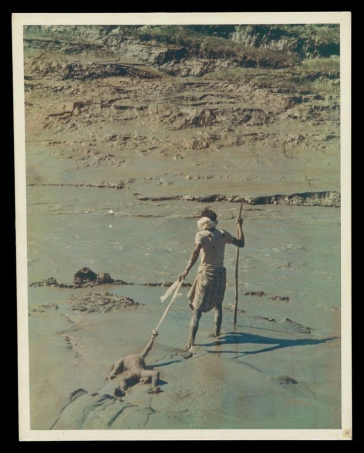 Man Pulling Drowned Child From River