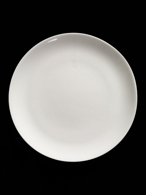 Empty White Plate on Black Background