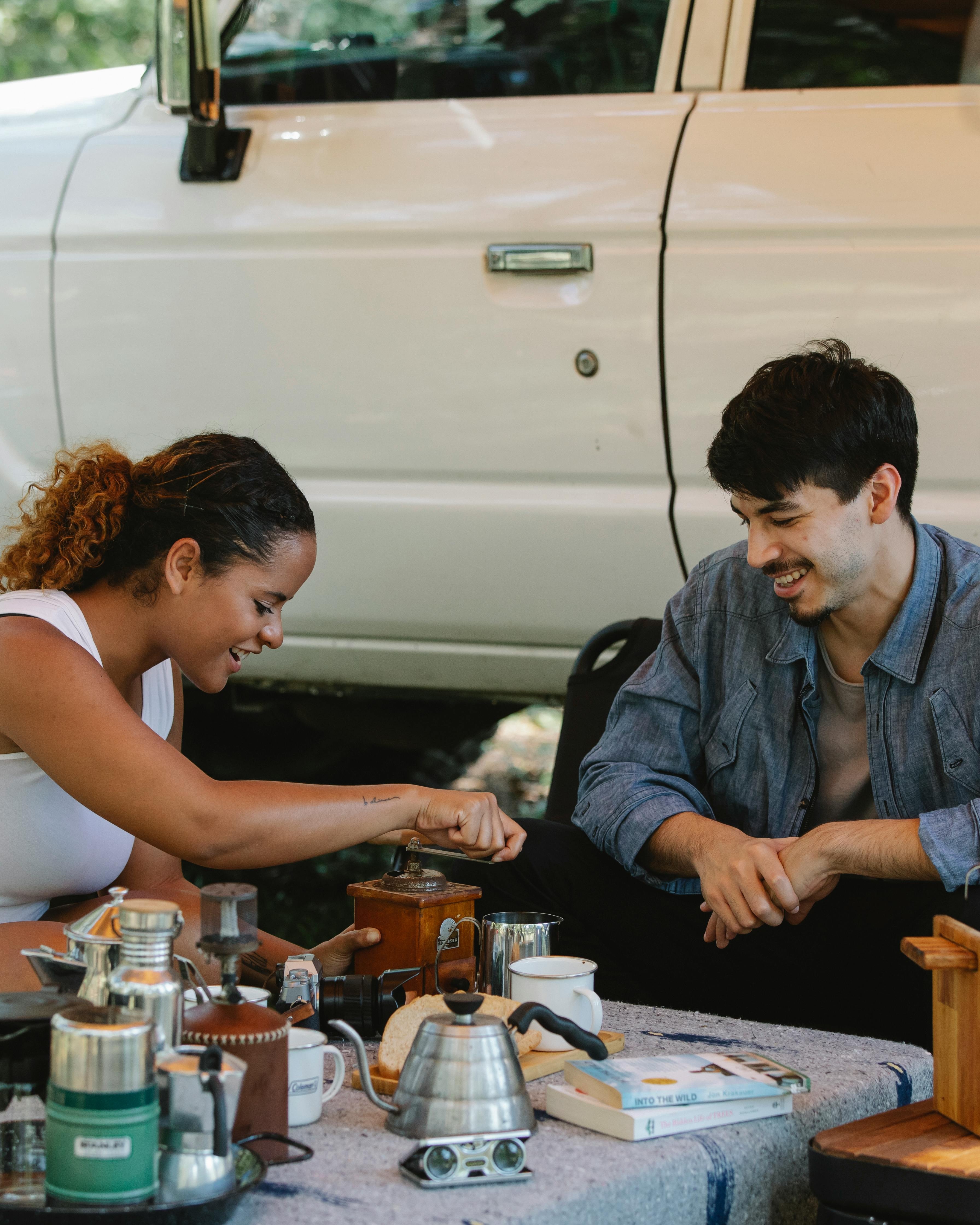 Couple Making Coffee While Camping