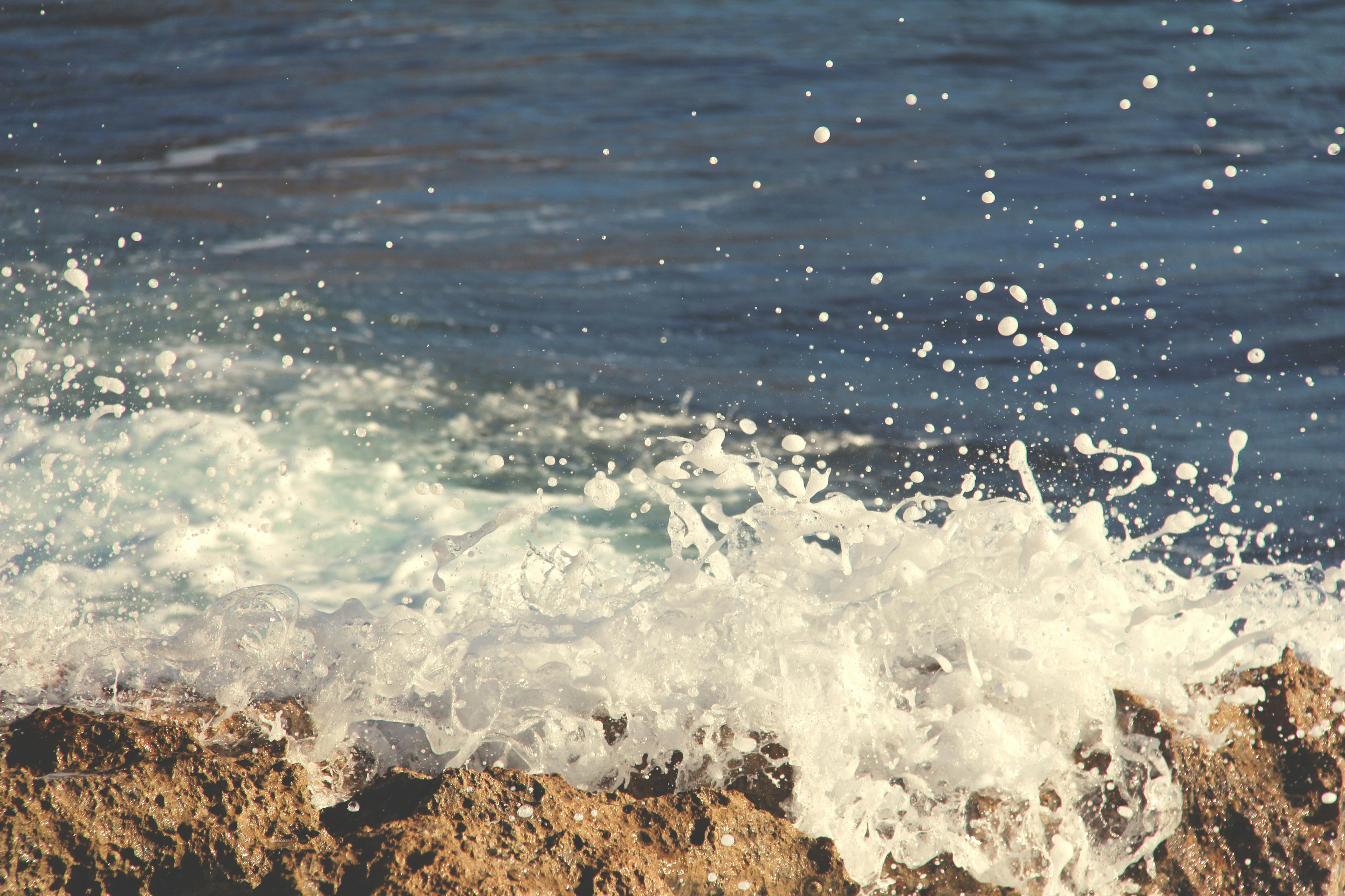 Waves Crashing on Coastal Rocks