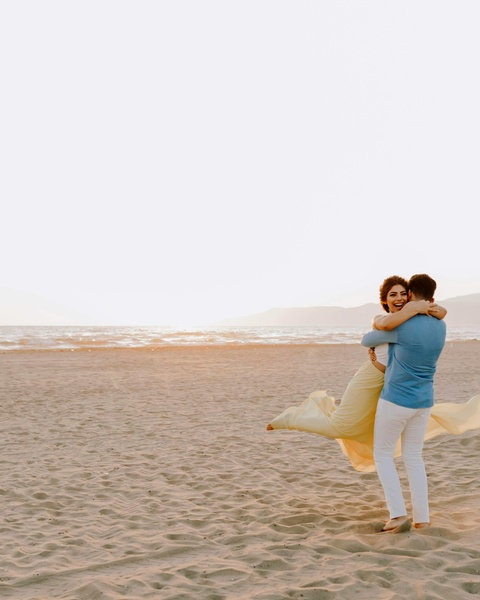 Couple Hugging on Sandy Beach