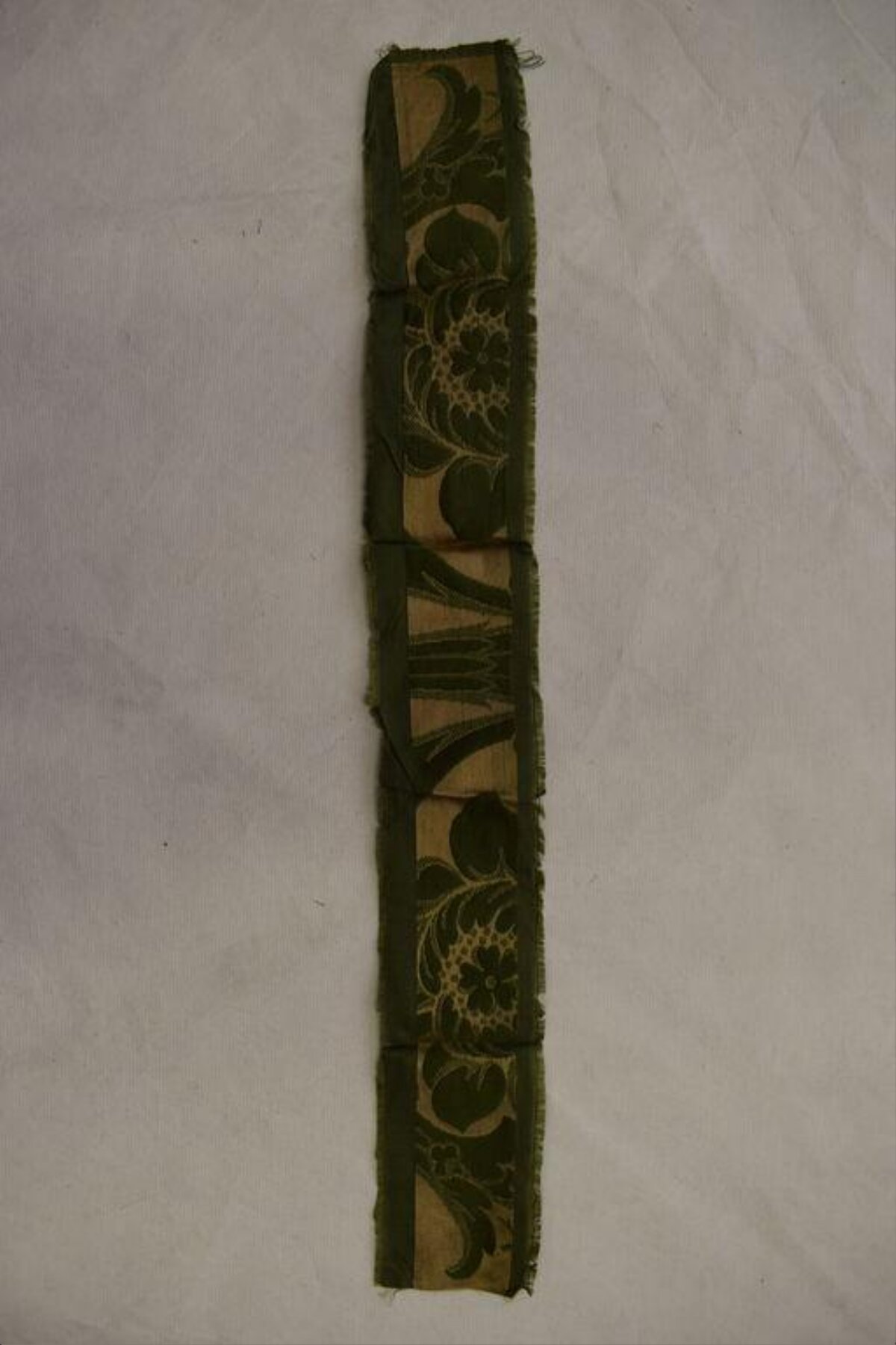 Folded Green Floral Patterned Fabric Strip