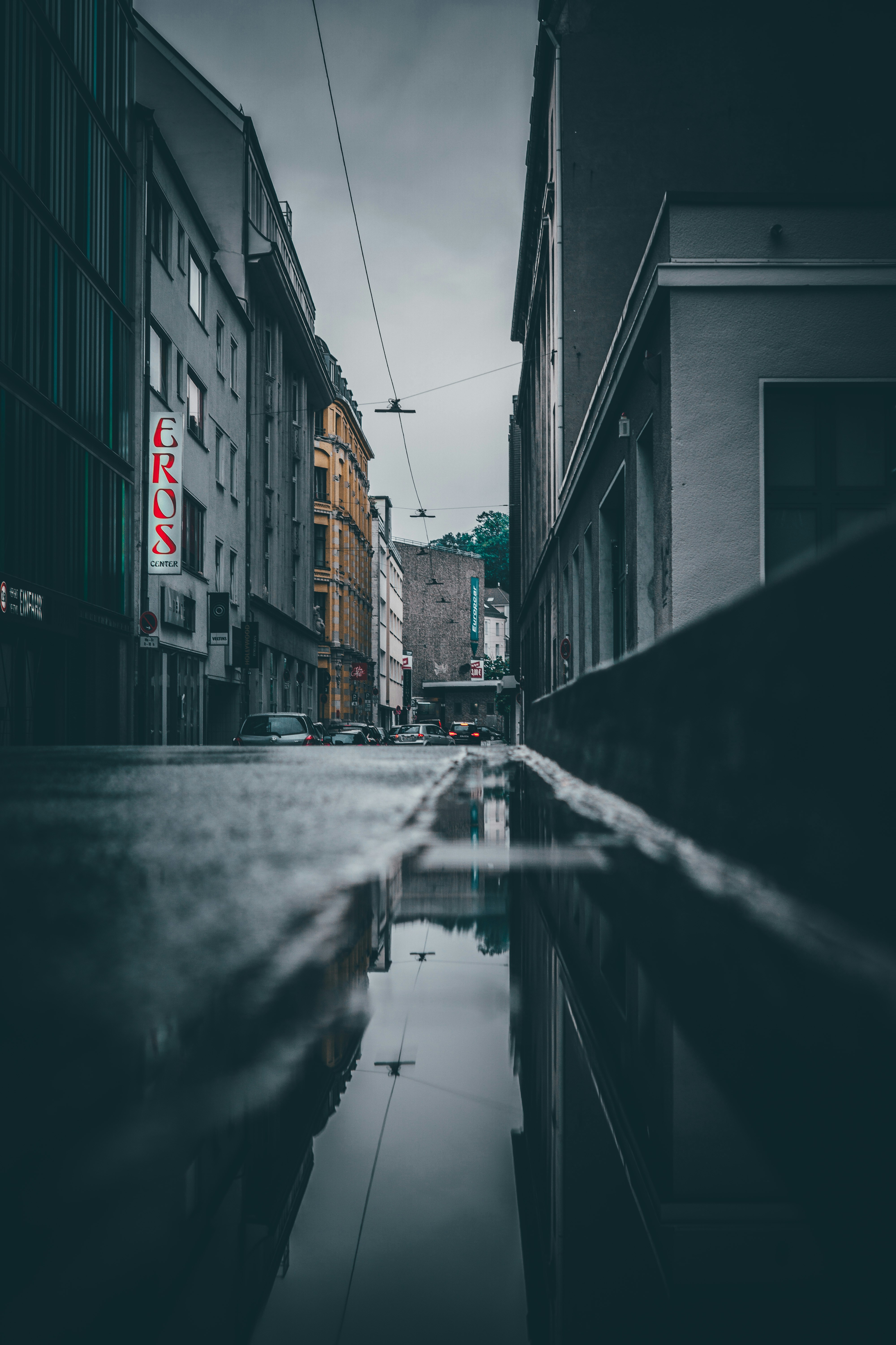 Rainy City Alley Puddle Reflection