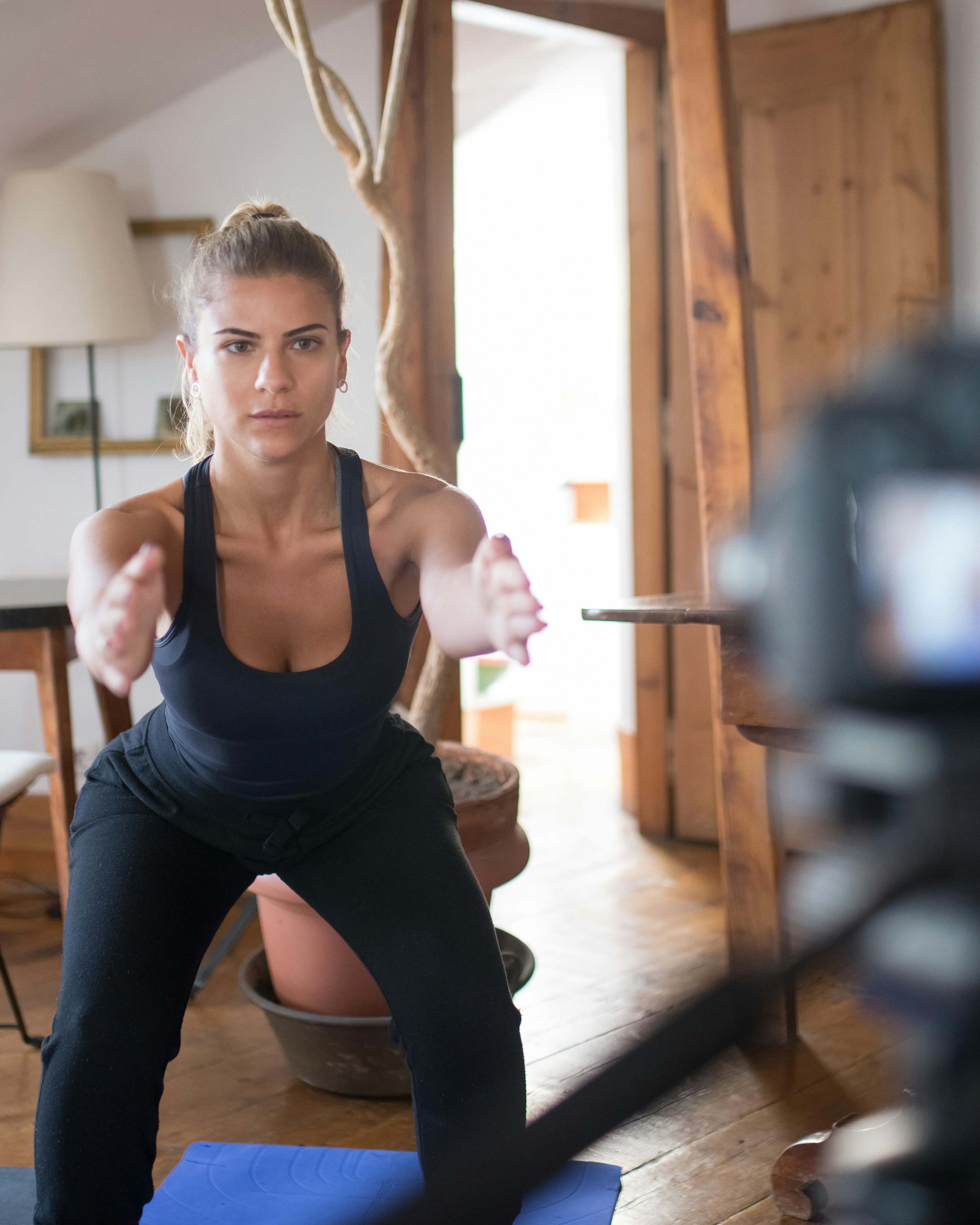 Woman Doing Squat for Home Workout Video