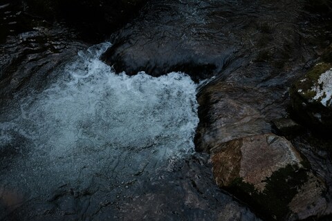 Mountain Stream Flowing Over Rocks