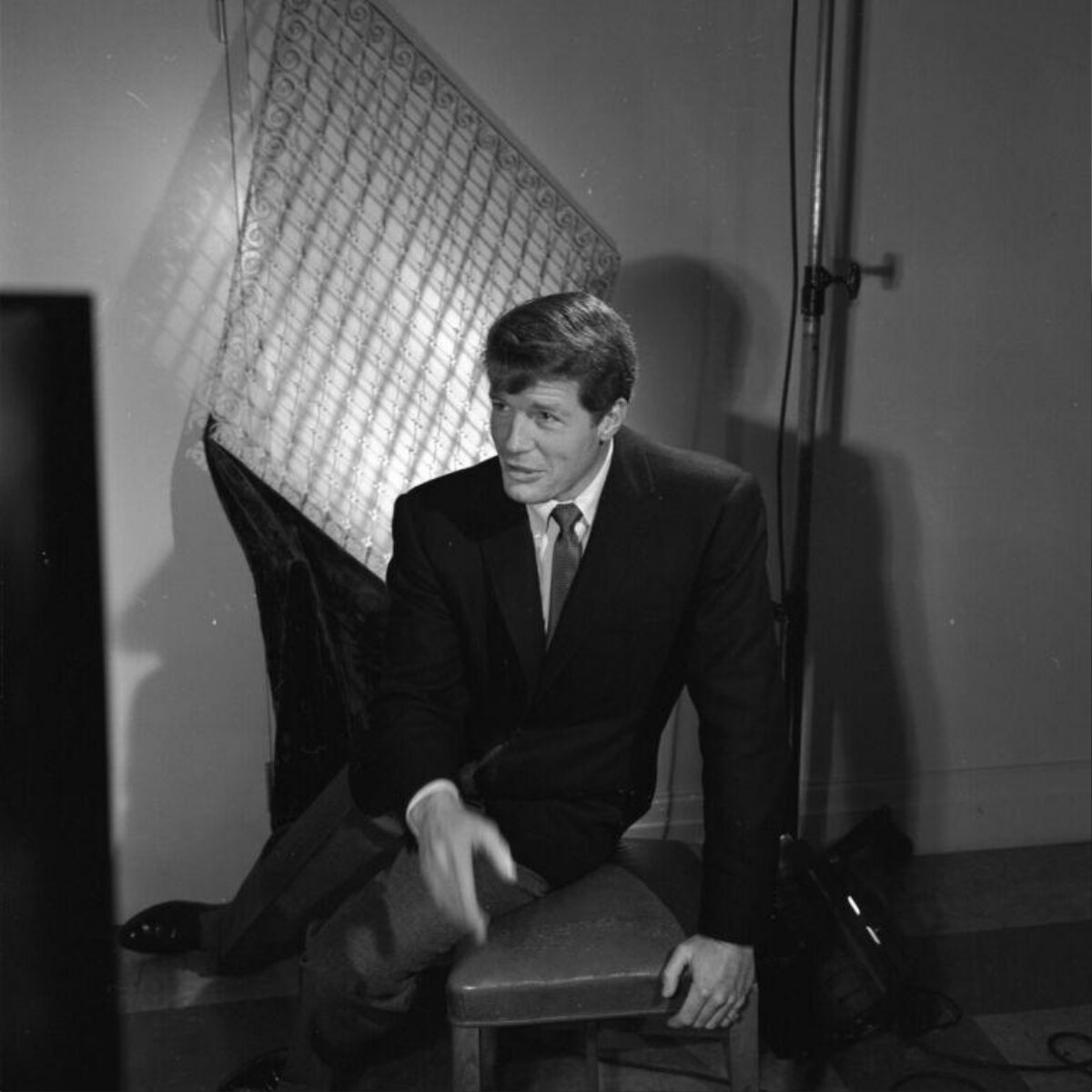 Man In Suit Posing In Photo Studio