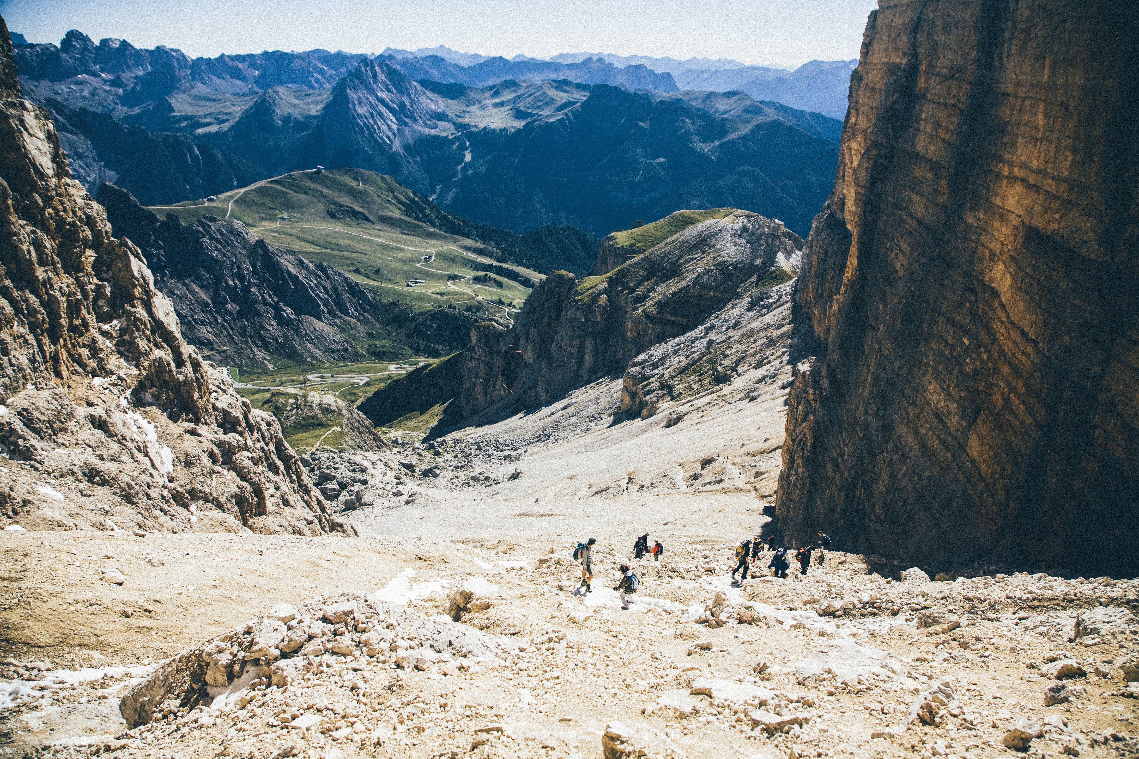 Hikers Trekking in Alpine Mountains