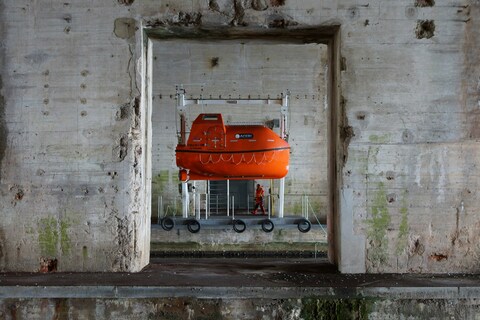 Orange Lifeboat in Old Concrete Structure