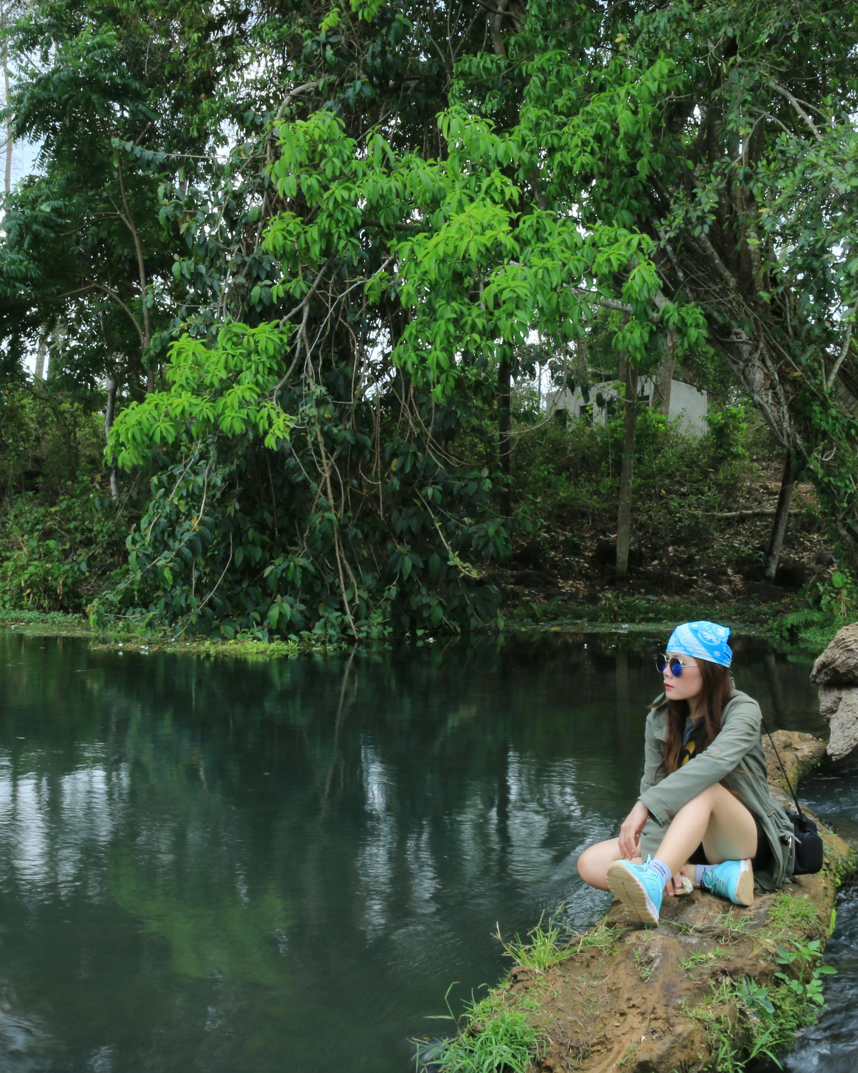 Woman Resting By Forest River