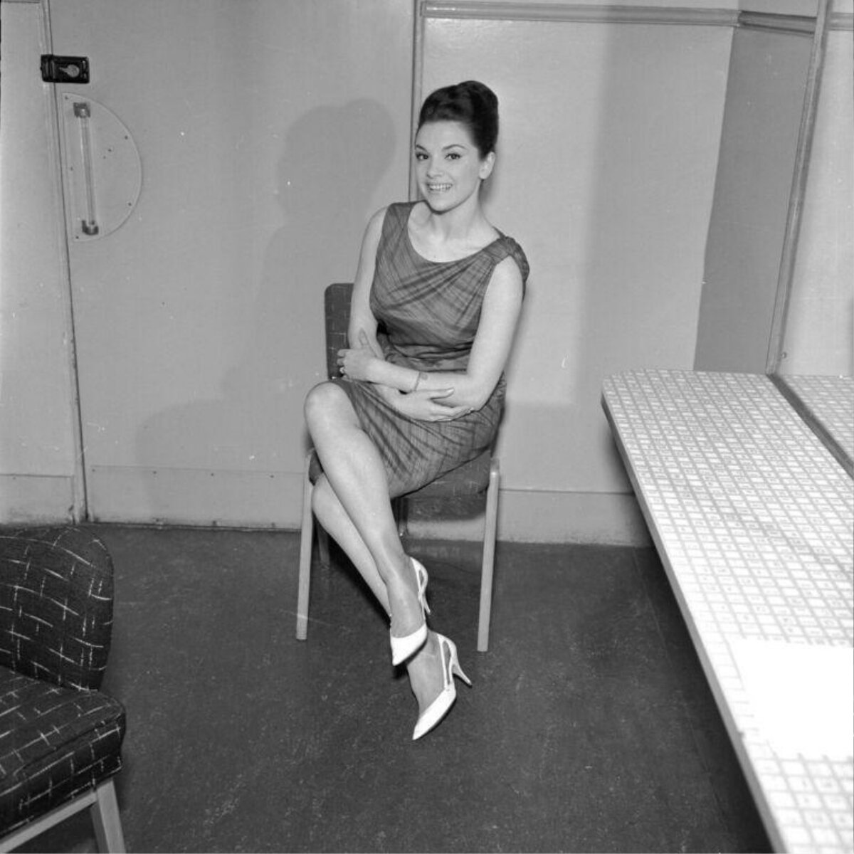 Smiling Woman Sitting on Chair