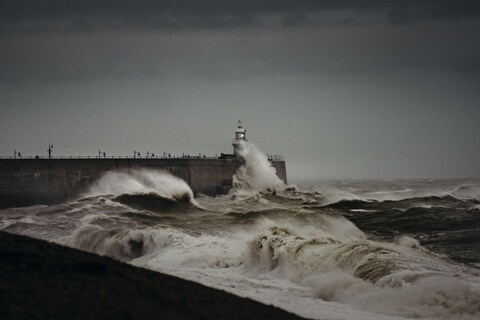 Storm Waves Hitting Lighthouse Breakwater