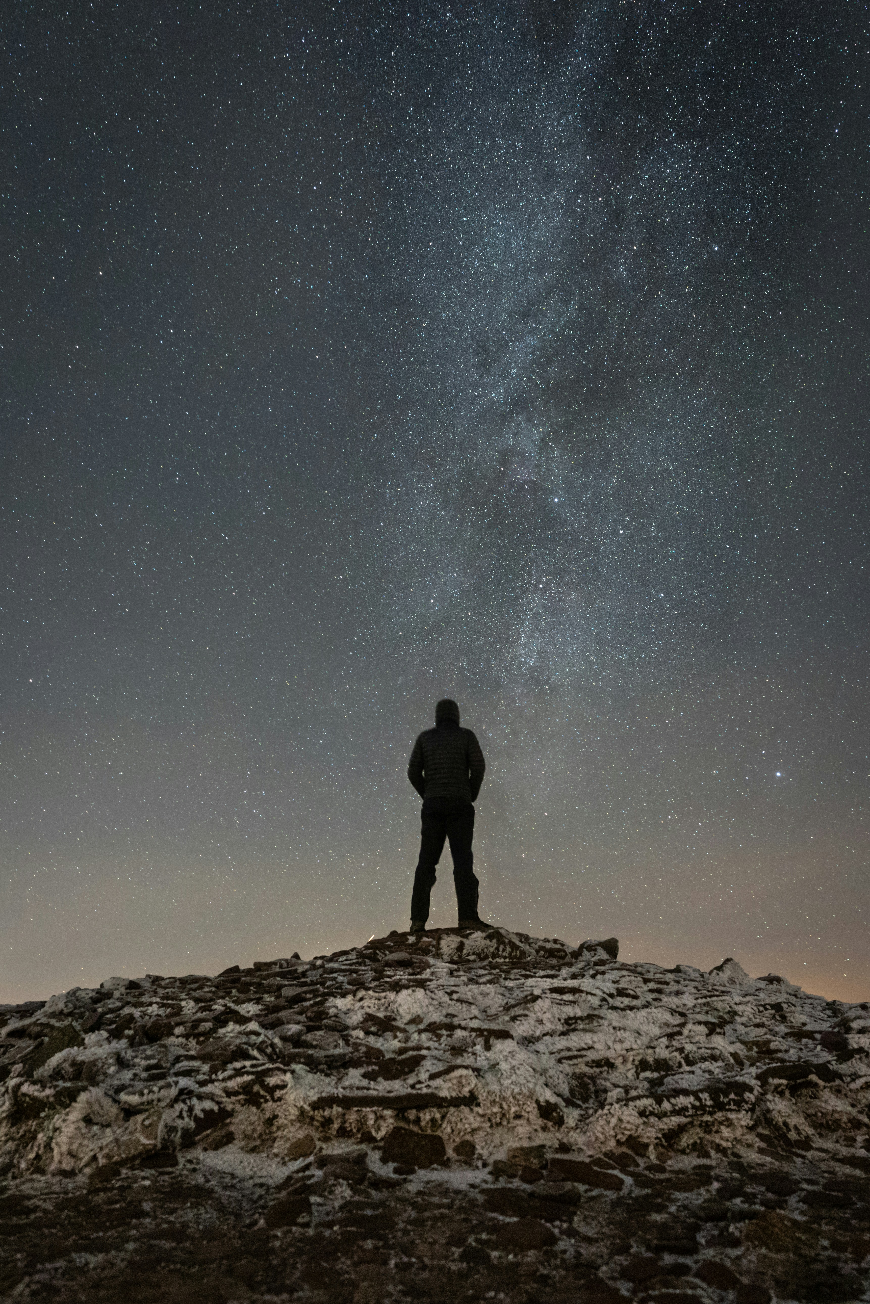 Man Watching Starry Sky On Frosty Peak