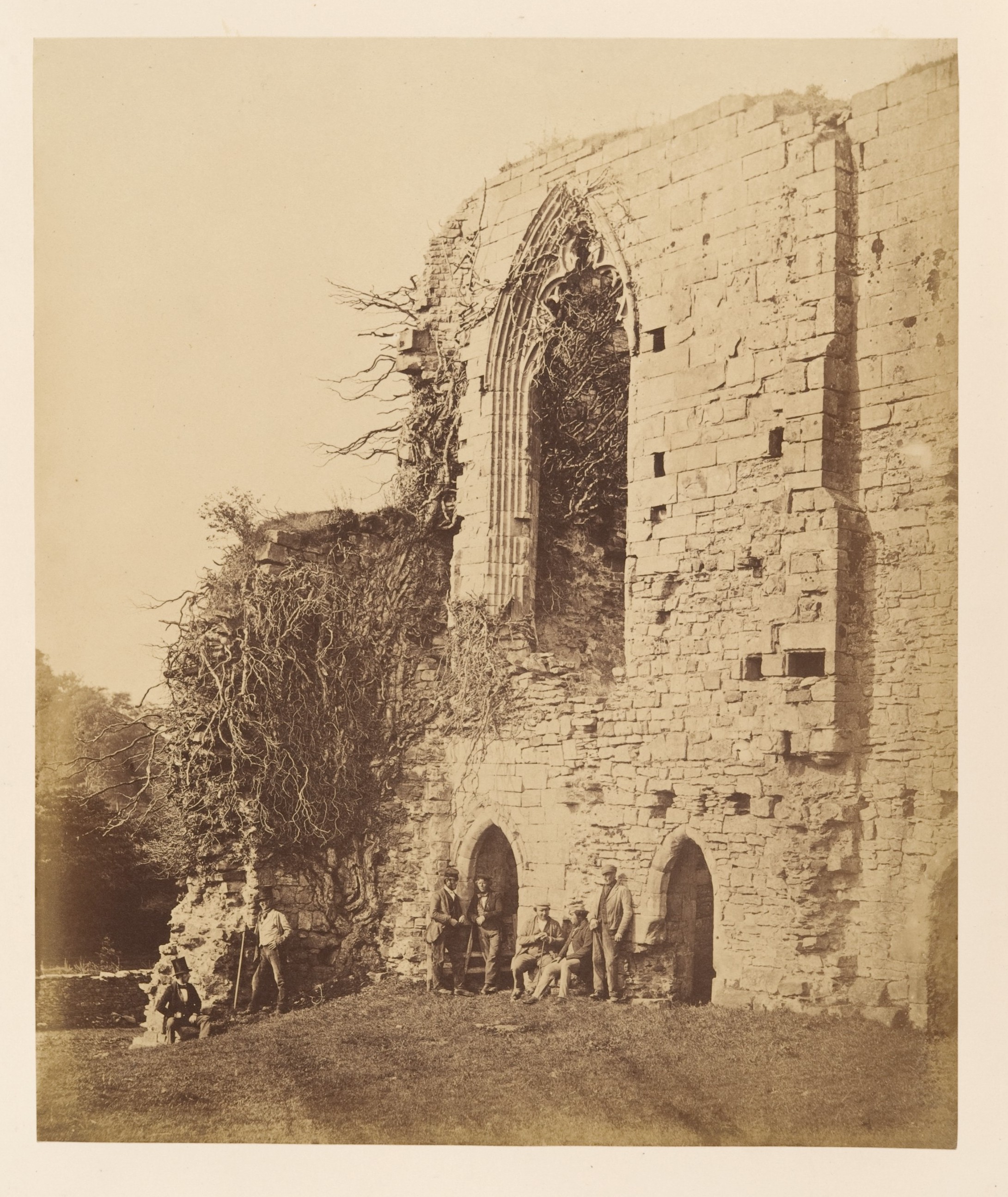 Group of Men Posing at Stone Ruins