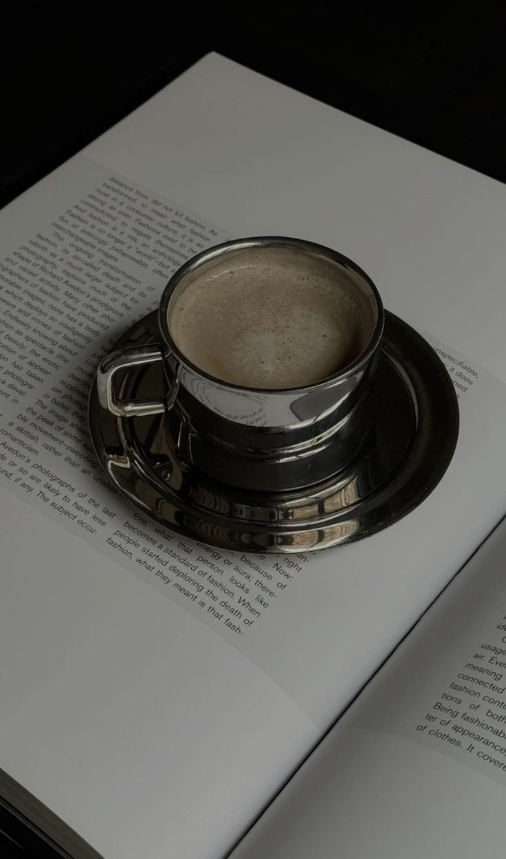 Coffee Cup on Open Book