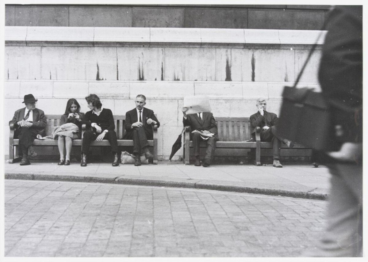 People Resting on Street Bench