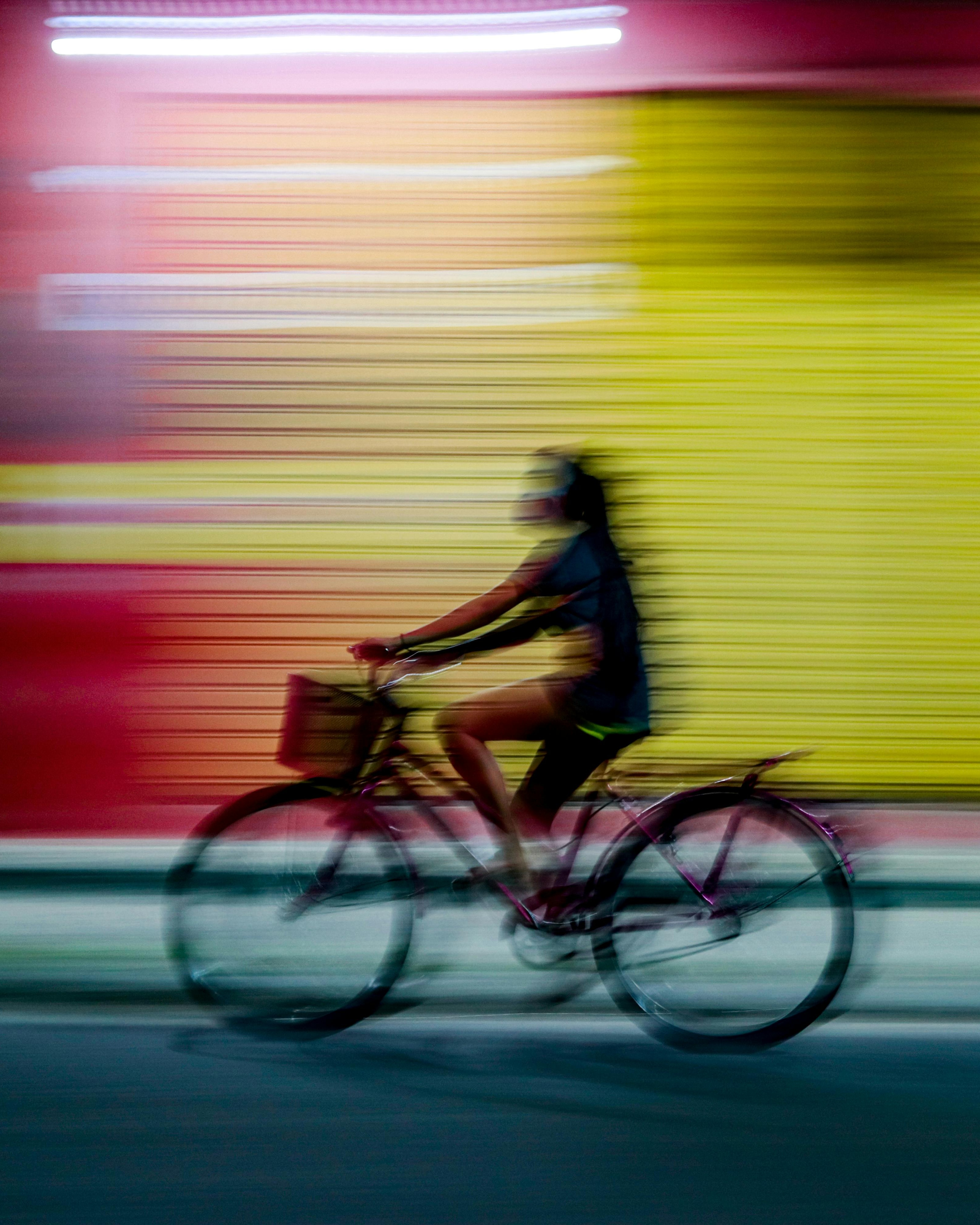 Woman Cycling At Night