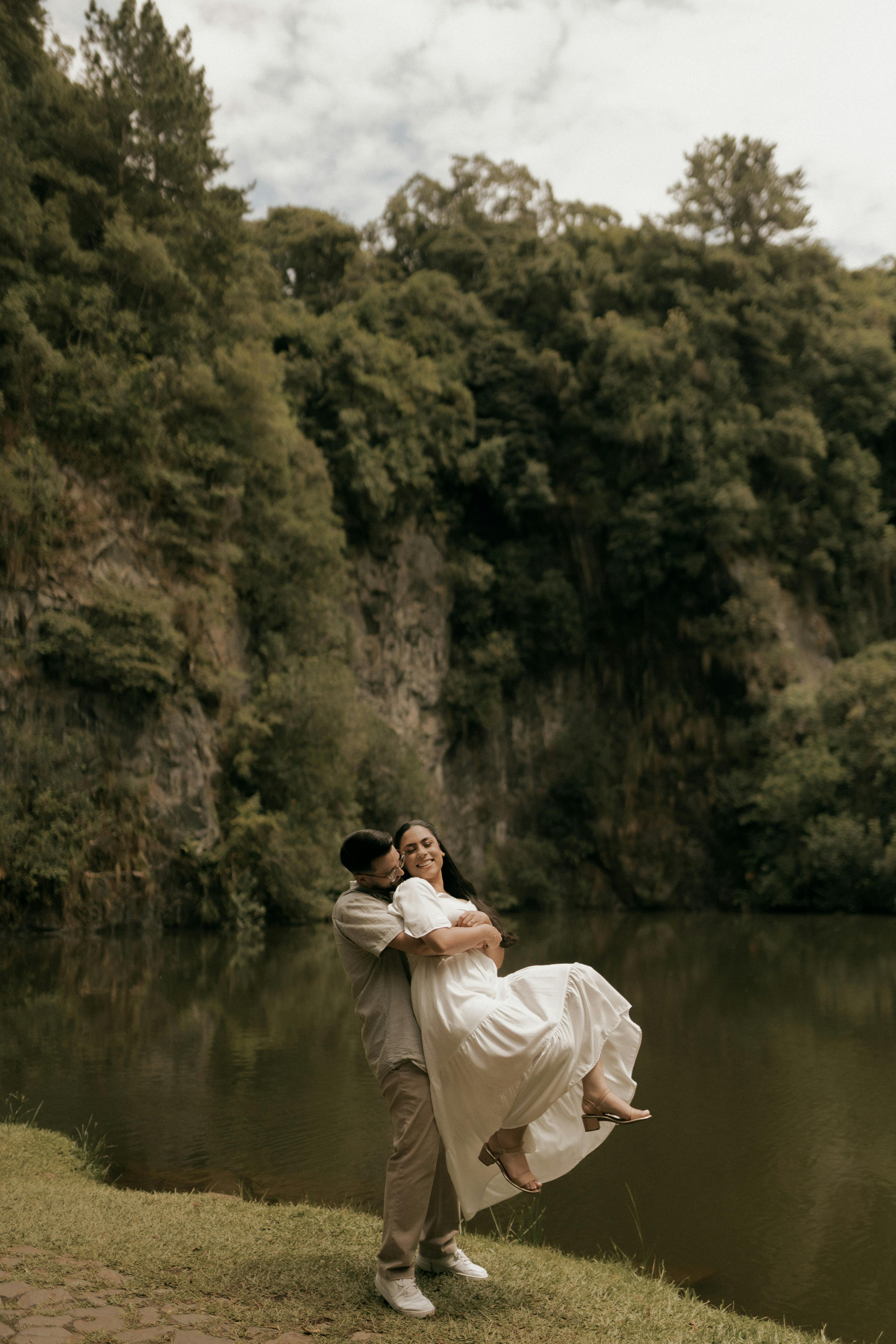 Couple Embracing By Calm Lake