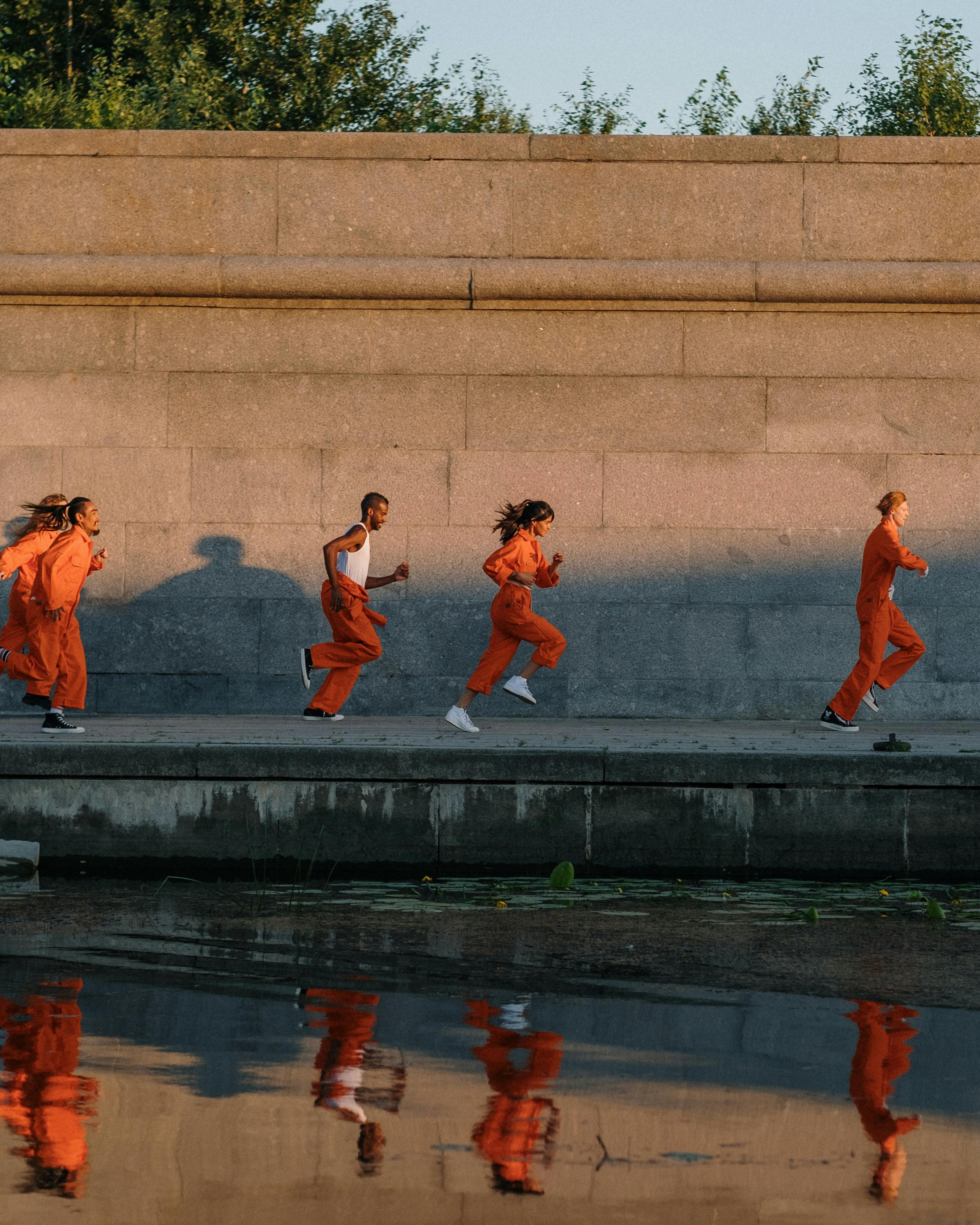 Five Runners on Riverside Embankment