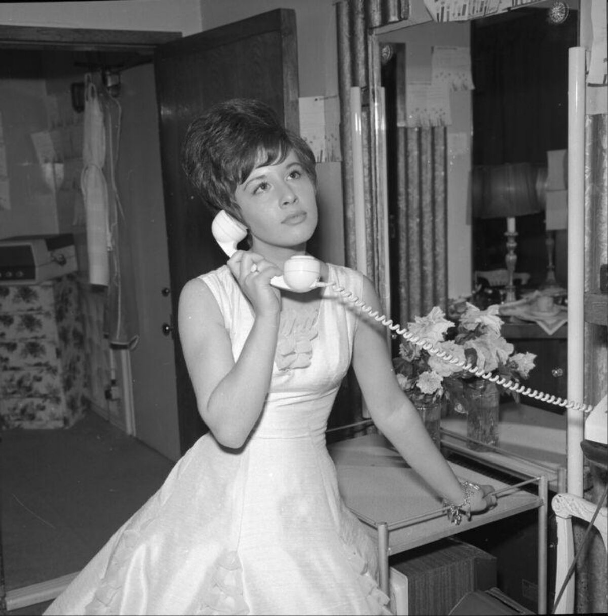 Young Woman Talking on Corded Telephone