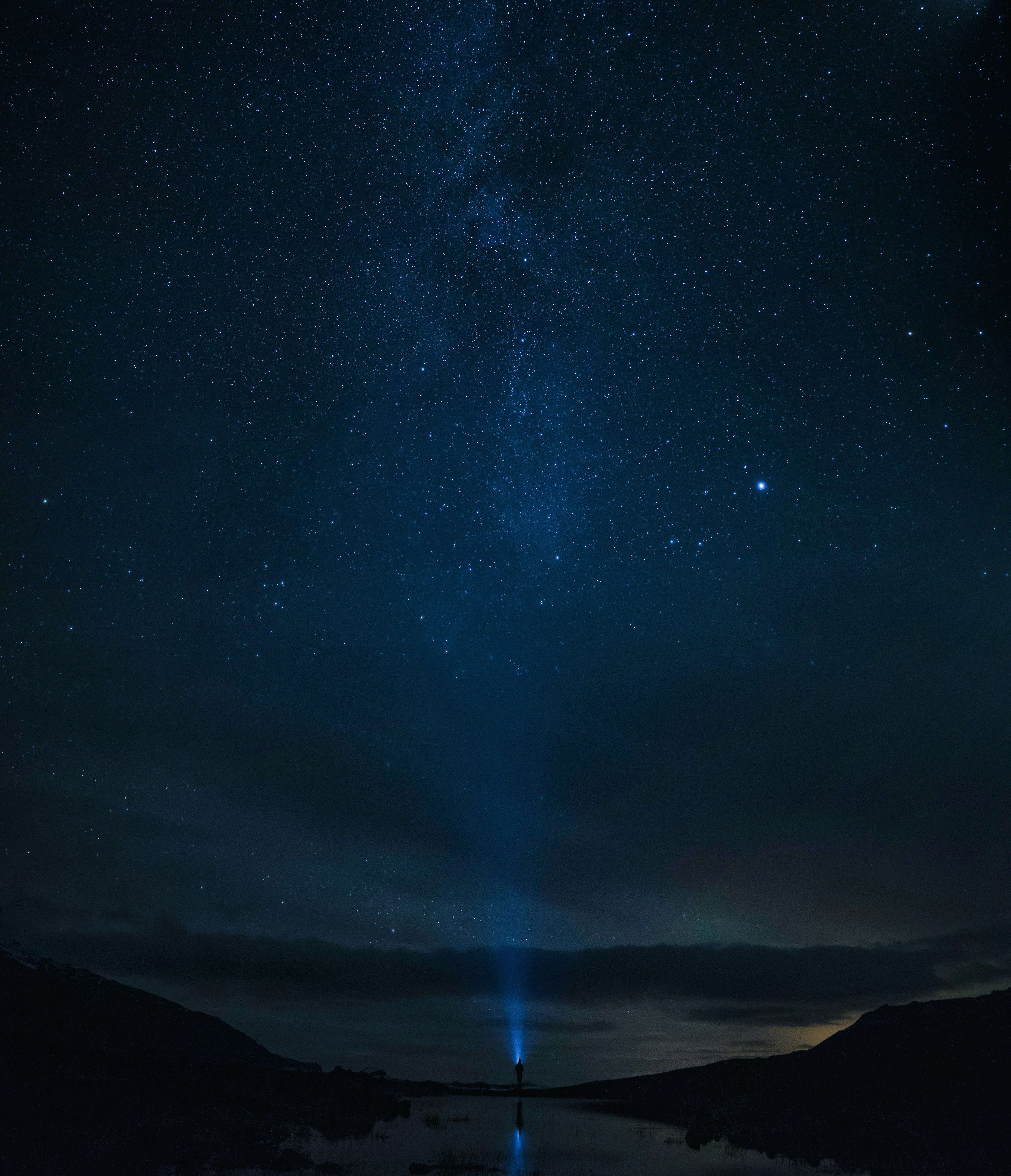 Lone Person Under Starry Night Sky